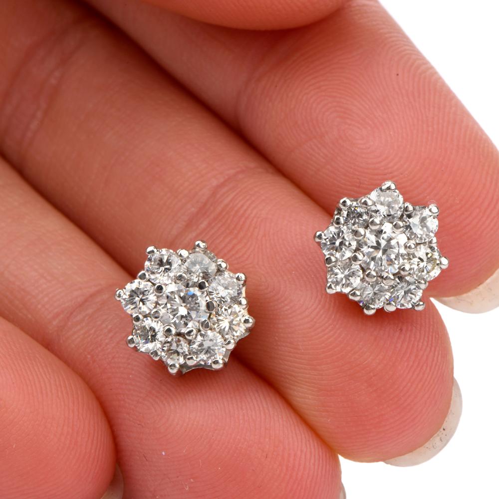 These earrings were inspired in a floral motif and crafted in 

Luxurious Platinum.

Featuring 9 round faceted diamonds in each ear, 

these diamonds radiate in bright white fire and brilliance.

Diamond weight is collectively appx. 2.50 carats and