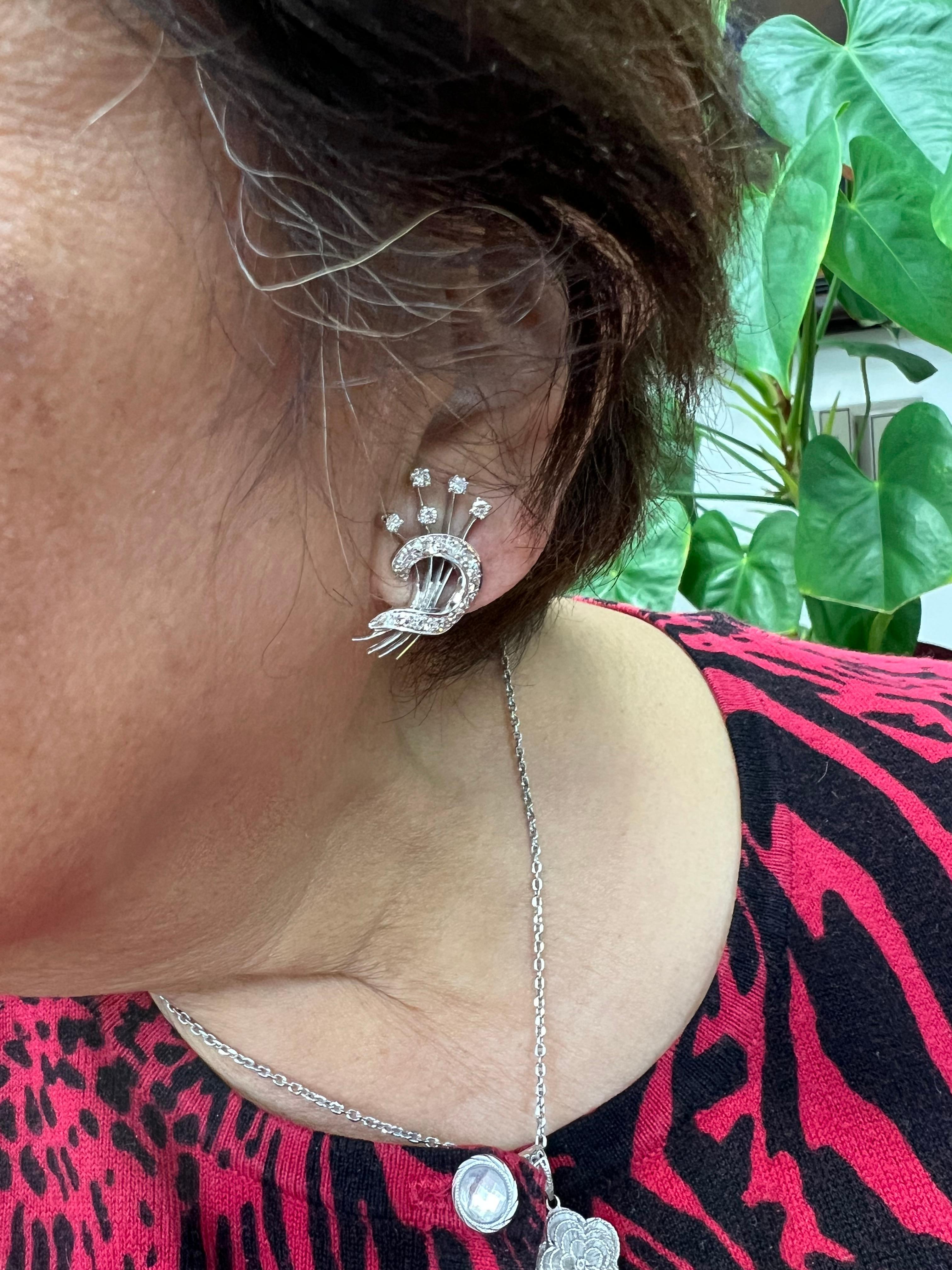 1950s Diamond Floral Spray 14k white gold clip-on earrings.

The 1950s Diamond Floral Spray 14K White Gold Clip-On Earrings epitomize the exquisite craftsmanship and design aesthetics of mid-20th century jewelry. Characterized by their intricate