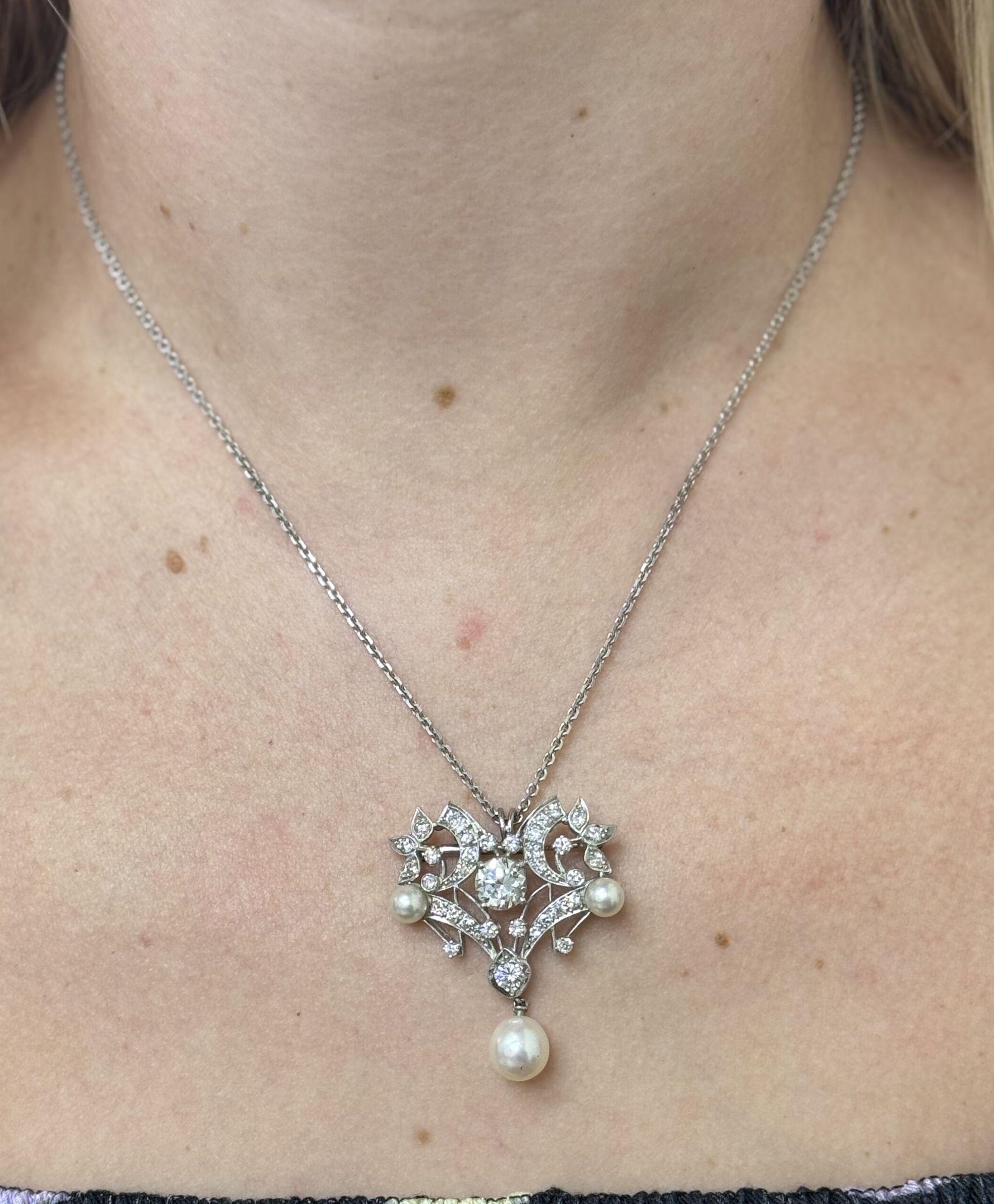 1950s Midcentury 14k gold chain with a brooch/pendant suspended. Set with Old European cut diamond in the center approx. 1.26ct J/VS. Surrounding stones are approx. 0.55ctw, and pearls. Necklace is 18