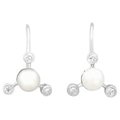 Boucles d'oreilles en or blanc avec diamants et perles des années 1950
