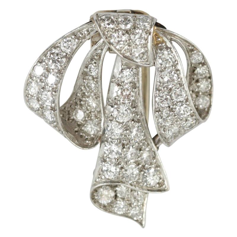Vintage Tied Ribbon Brooch in Platinum set with Diamonds, English circa 1950 For Sale
