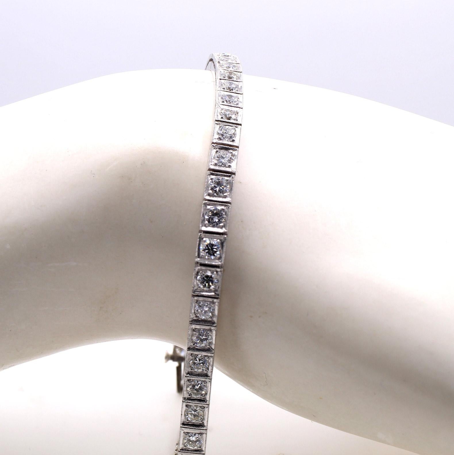 Beautifully handcrafted, this ca 1950s platinum tennis bracelet features 40 bright white and sparkly round brilliant cut diamonds with an approximate total diamond weight of 3 carats. The average color and clarity are G VS to SI. Each box link has