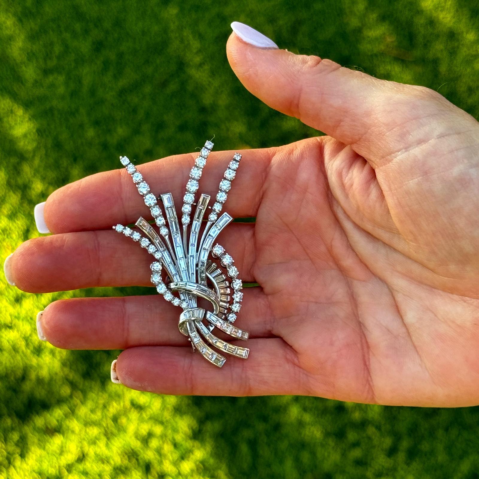 This 1950s diamond platinum brooch is a classic piece of jewelry that embodies the elegance and glamour of mid-century style. Crafted in platinum, the brooch features a design inspired by the delicate beauty of wheat, with intricate details and high