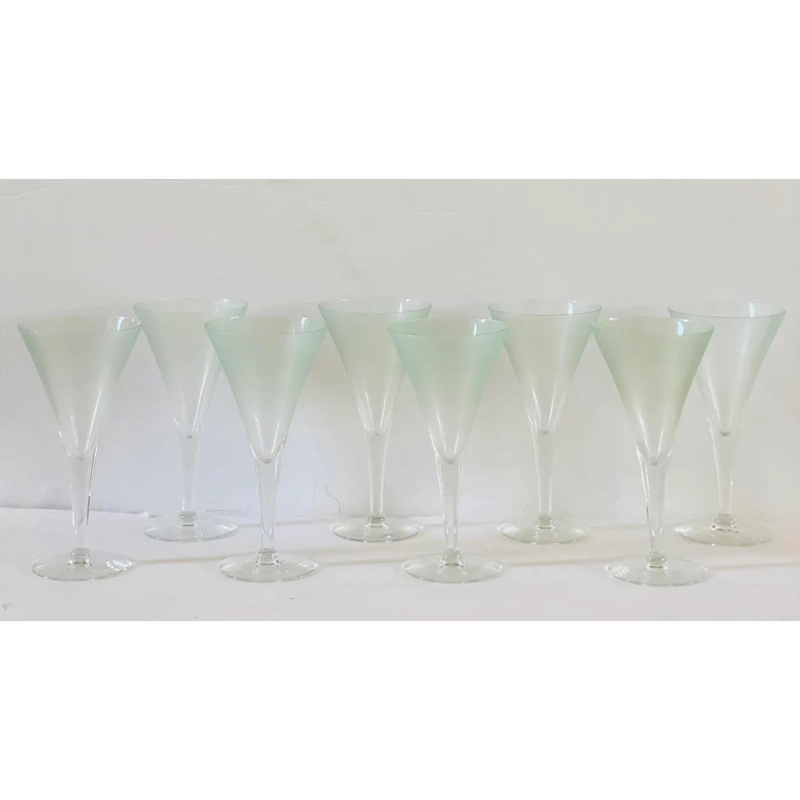 We are very pleased to offer an elegant set of champagne flutes or wine glasses by Dorothy Thorpe, circa the 1950s. The trumpet bowl showcases a very subtle frosted mint green that contrasts its smooth, clear tapered stem. Signed on the bottom. In