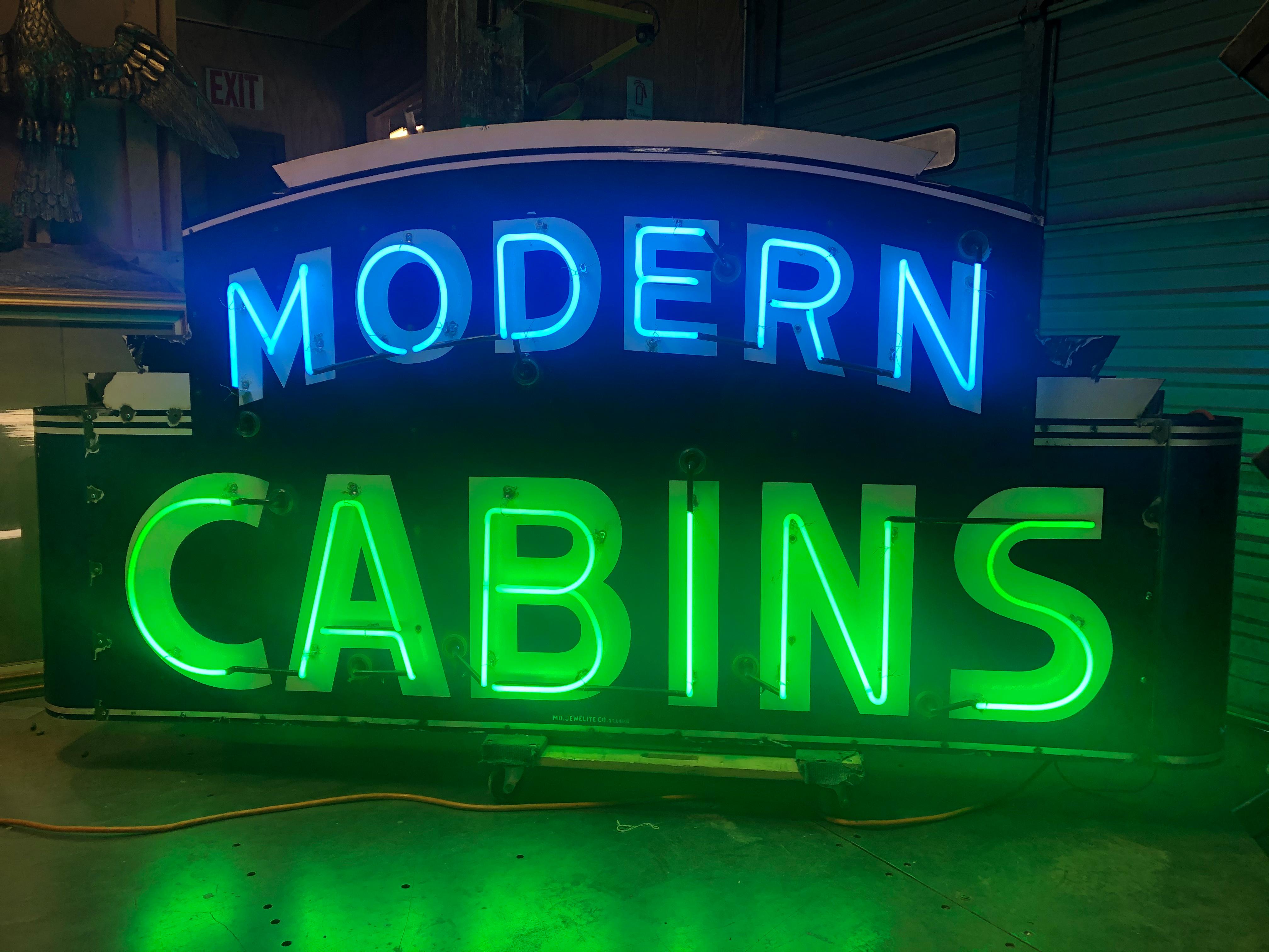 1950’s double sided Modern Cabins neon sign with enamel face. It has new transformer, new wiring and new neon.