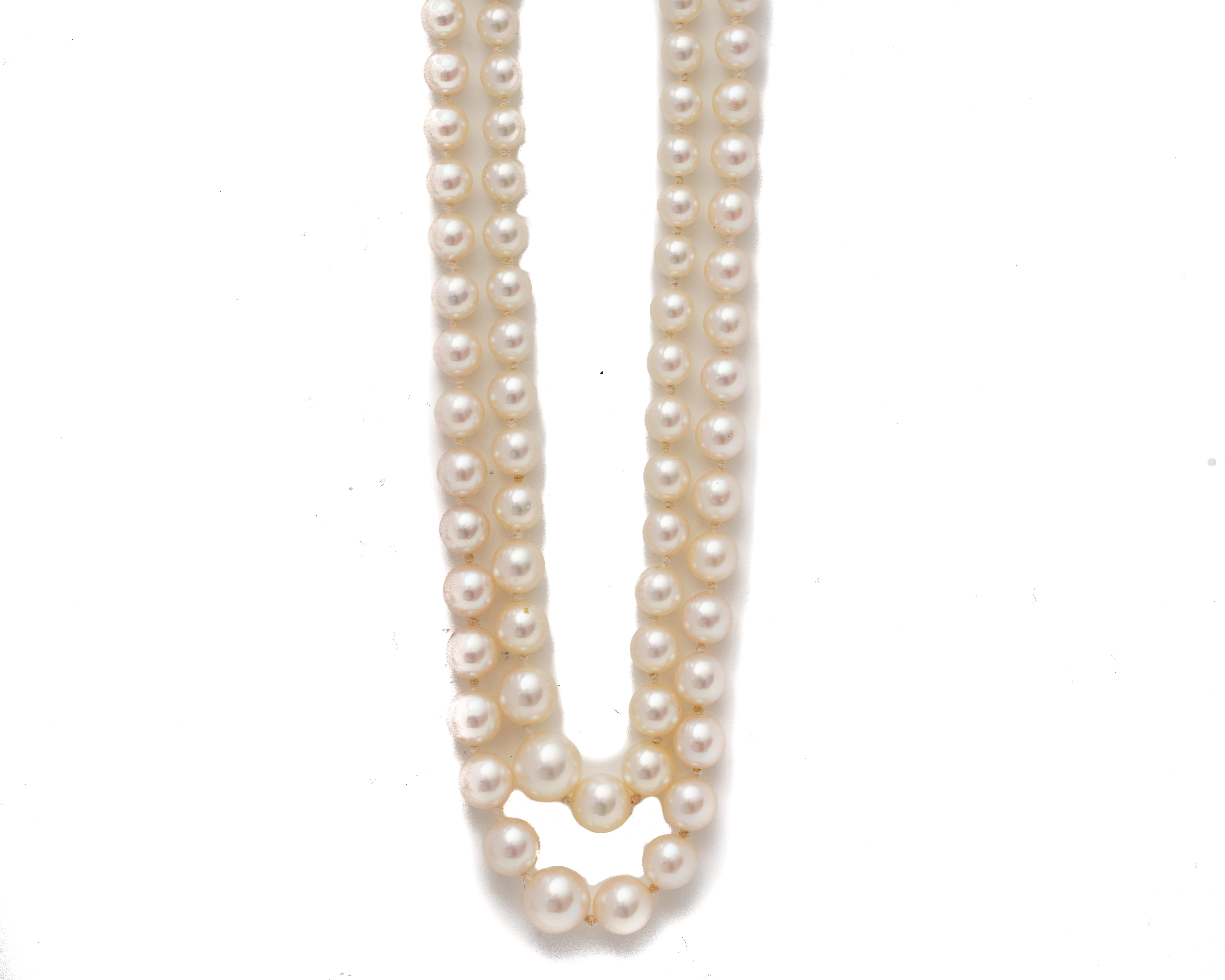 Necklace Details:
Graduating Pearls from 3 millimeter to 7 millimeter 
Weighs 28 grams
Measures approximately 20 inches 
Features a beautiful clasp with unique symmetrical detailing with a smaller accent pearl. The clasp is crafted in sterling