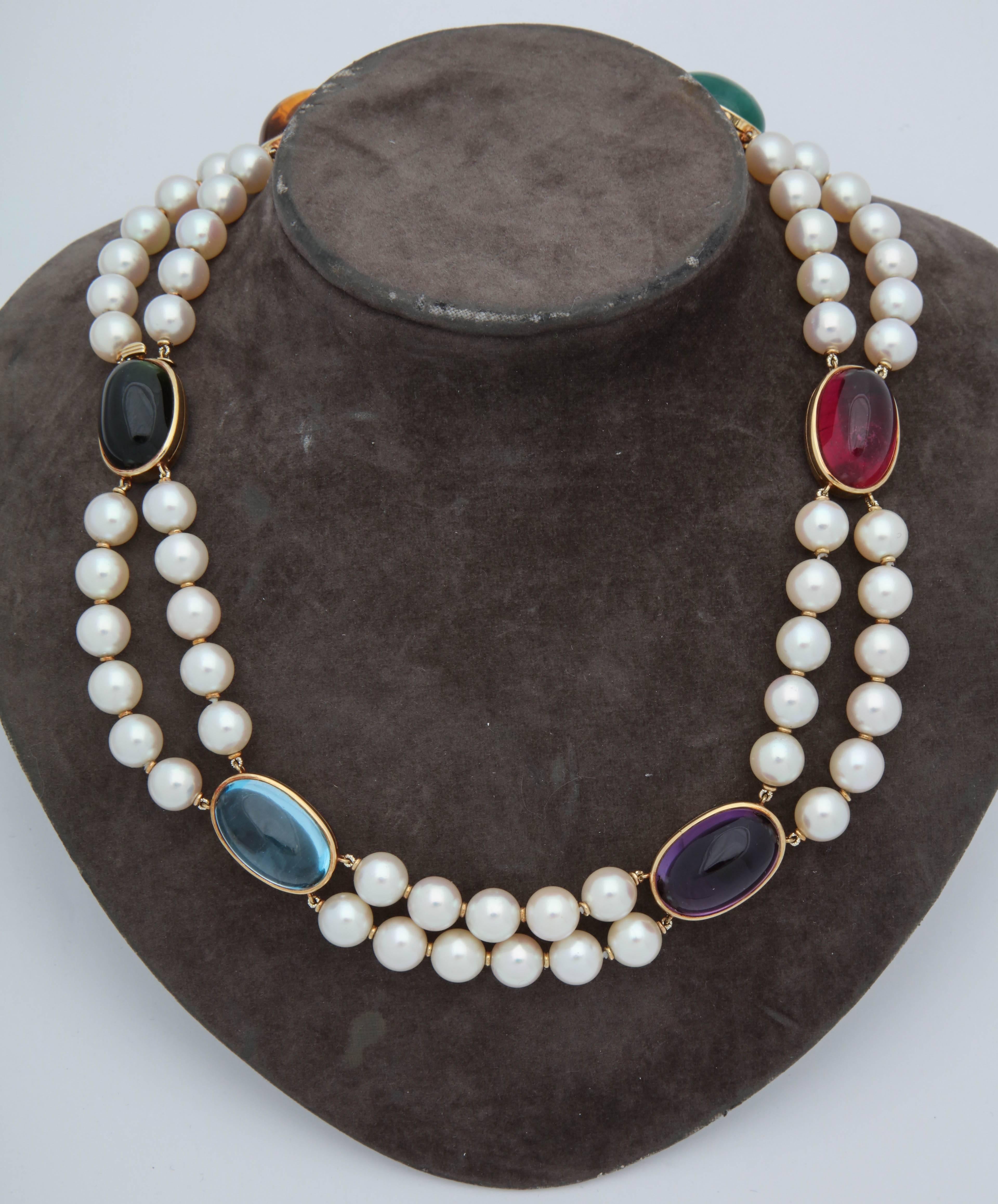 One Ladies Unusual Double Strand 9MM Pearl Choker Necklace Designed With Six Cabochon Colored Stones. One Large Emerald Cabochon,One Large Rubelite Cabochon,One Large Aquamarine Cabochon,One Large Citrine Cabochon,One Large Amethyst Cabochon, And
