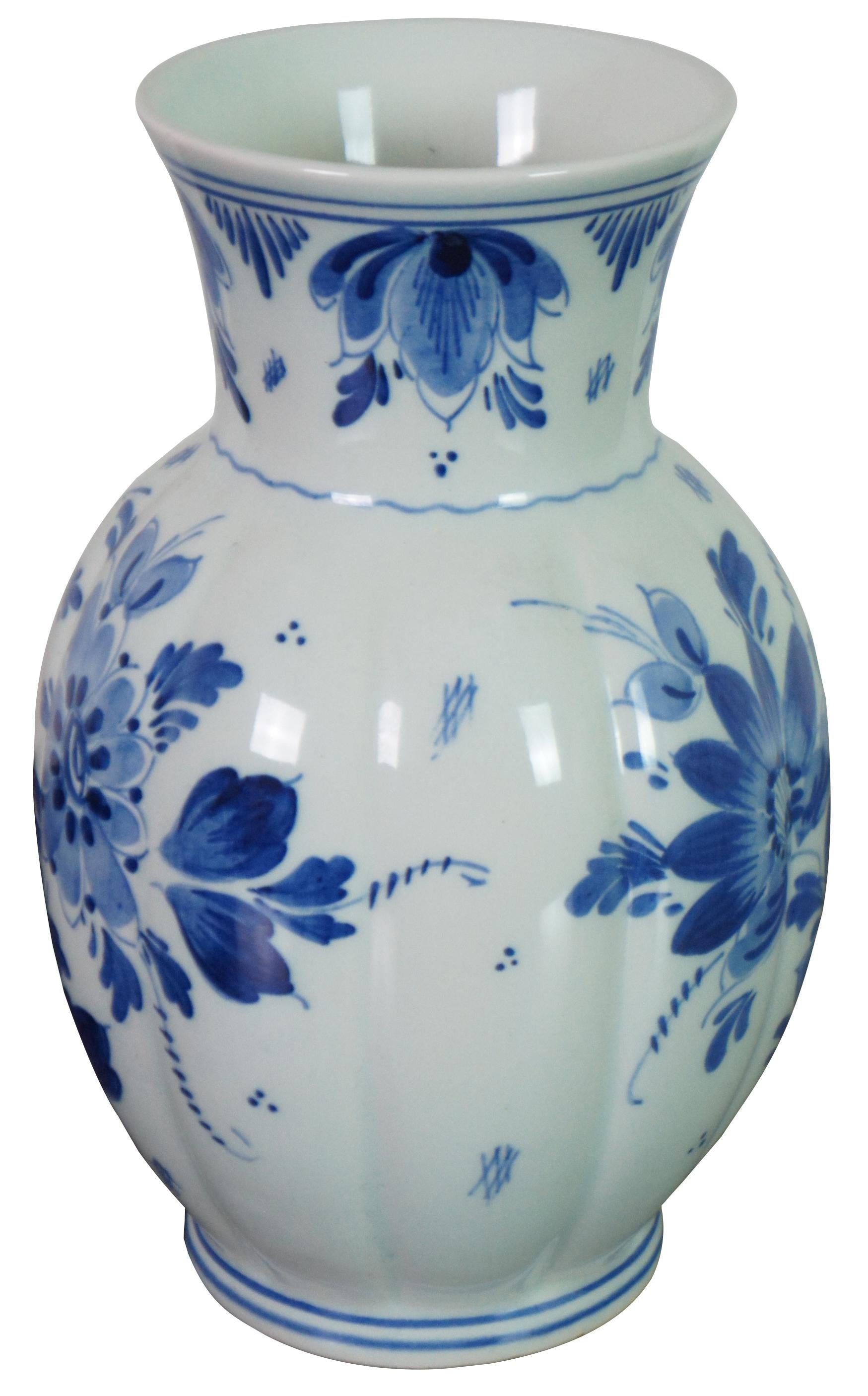 Vintage 1950s Delft Holland blue and white hand painted floral porcelain vase. Measures: 8