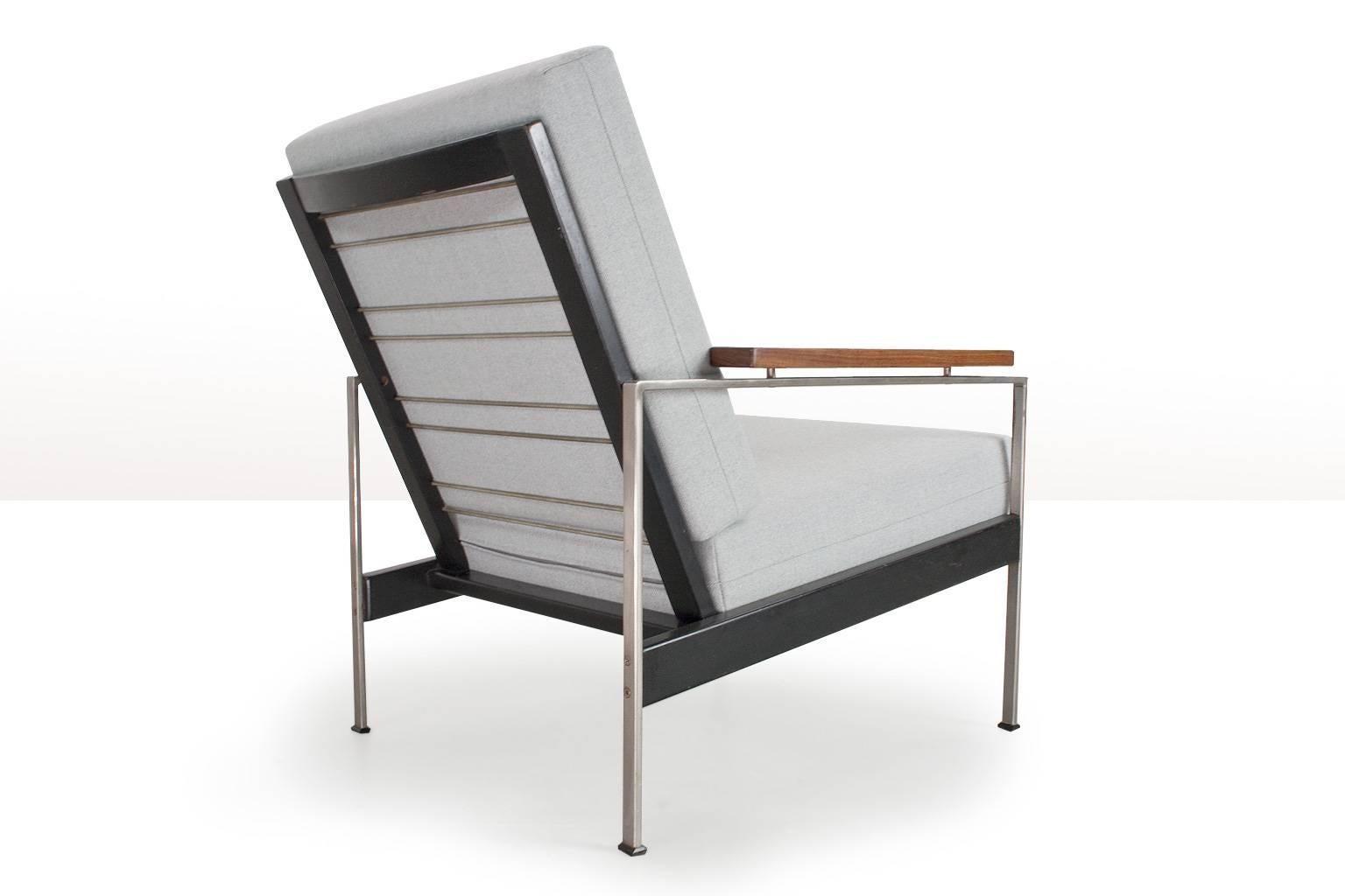Rob Parry lounge chair Lotus in black lacquered wood and metal, with new light grey Ploegwool upholstery. Completely checked and new upholstered. The listed item is in very good condition, light patina through use on the frame as shown on photos.