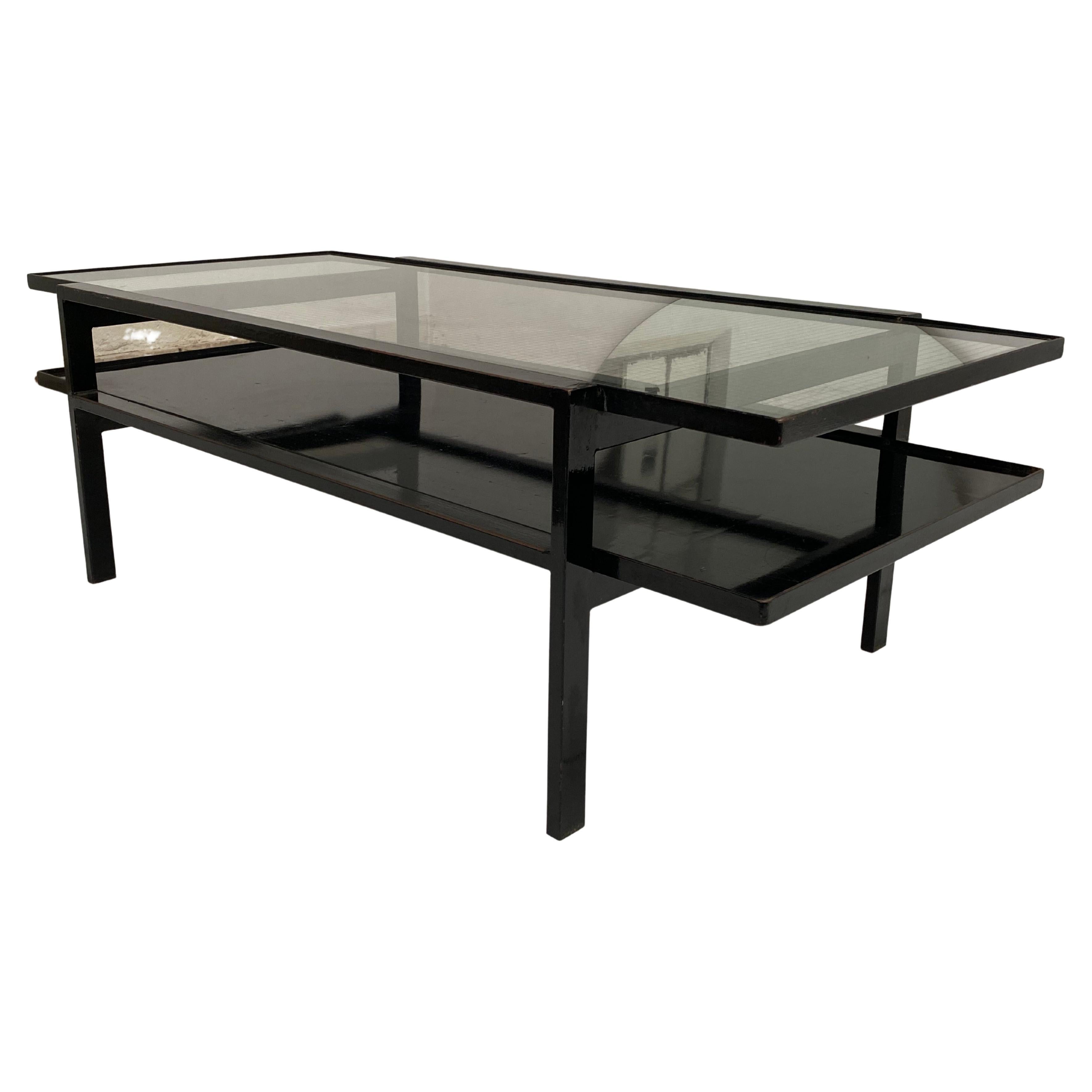 1950s Modernist 2 Tier Coffee table that came from an architects house in The Netherlands

A piece unique that was custom made by the previous owner

Heavy black enamelled steel frame with a zinc plate and steel wired safety glass top

Nice