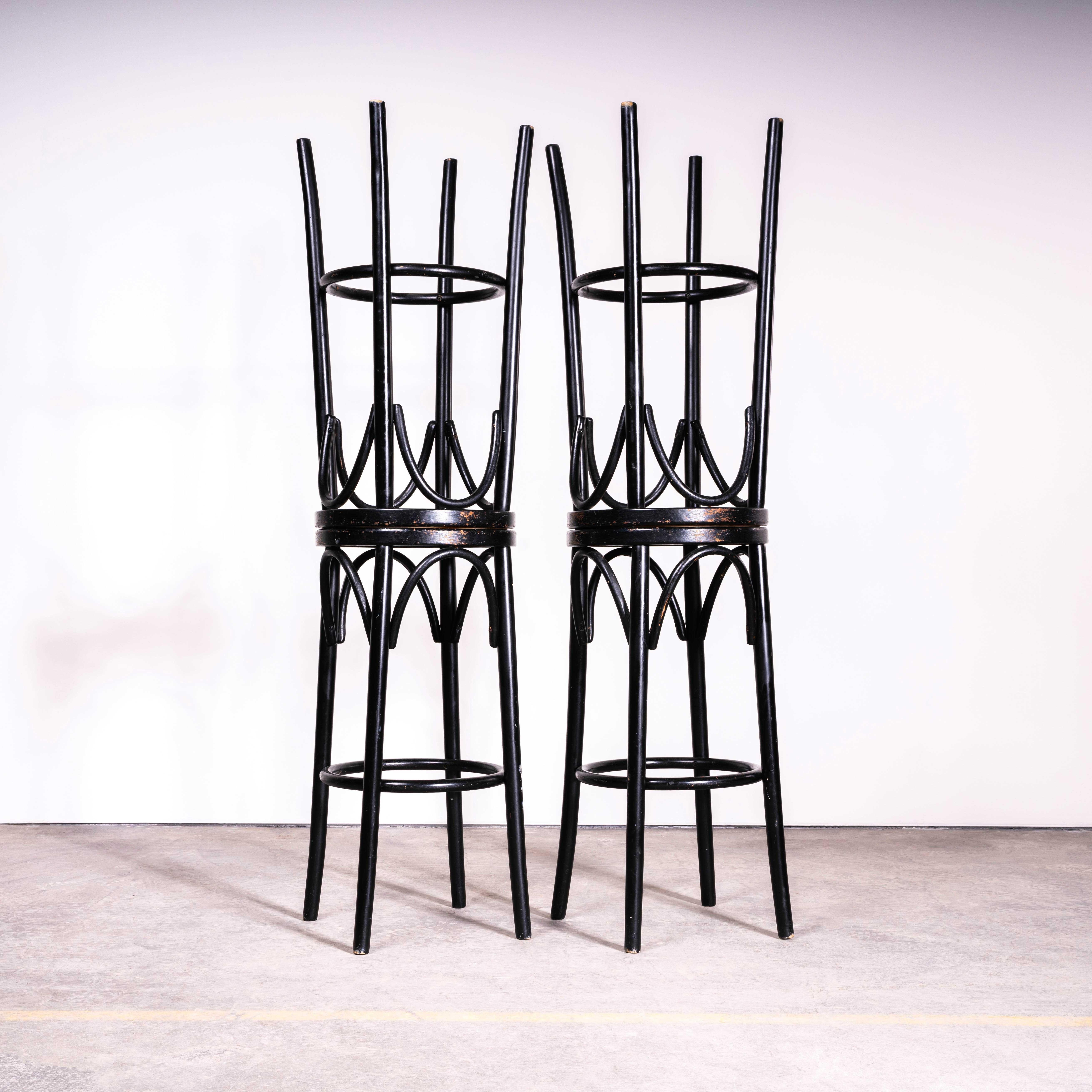 1950’s Elegant Ebonised Bar Stools – Set Of Four Cane Seat. 

High quality set of four classic bentwood bar stools in a dark ebonised finish with the original cane seats. The stools were made in Eastern Europe using solid steam bent beech, they are