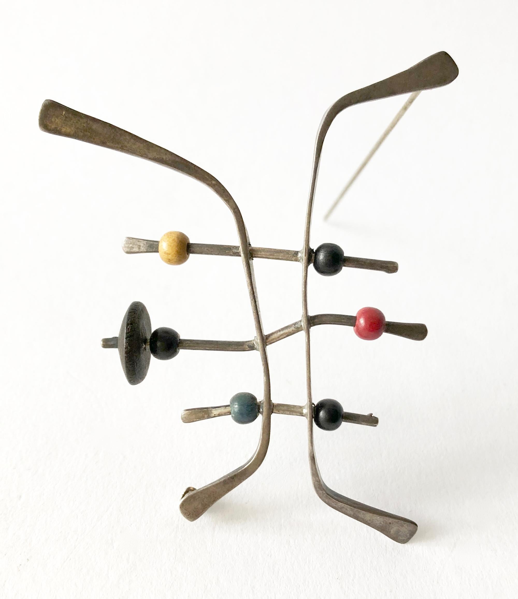 American modernist sterling silver brooch with wood beads, created by Ed Levin.  Brooch measures 2.25