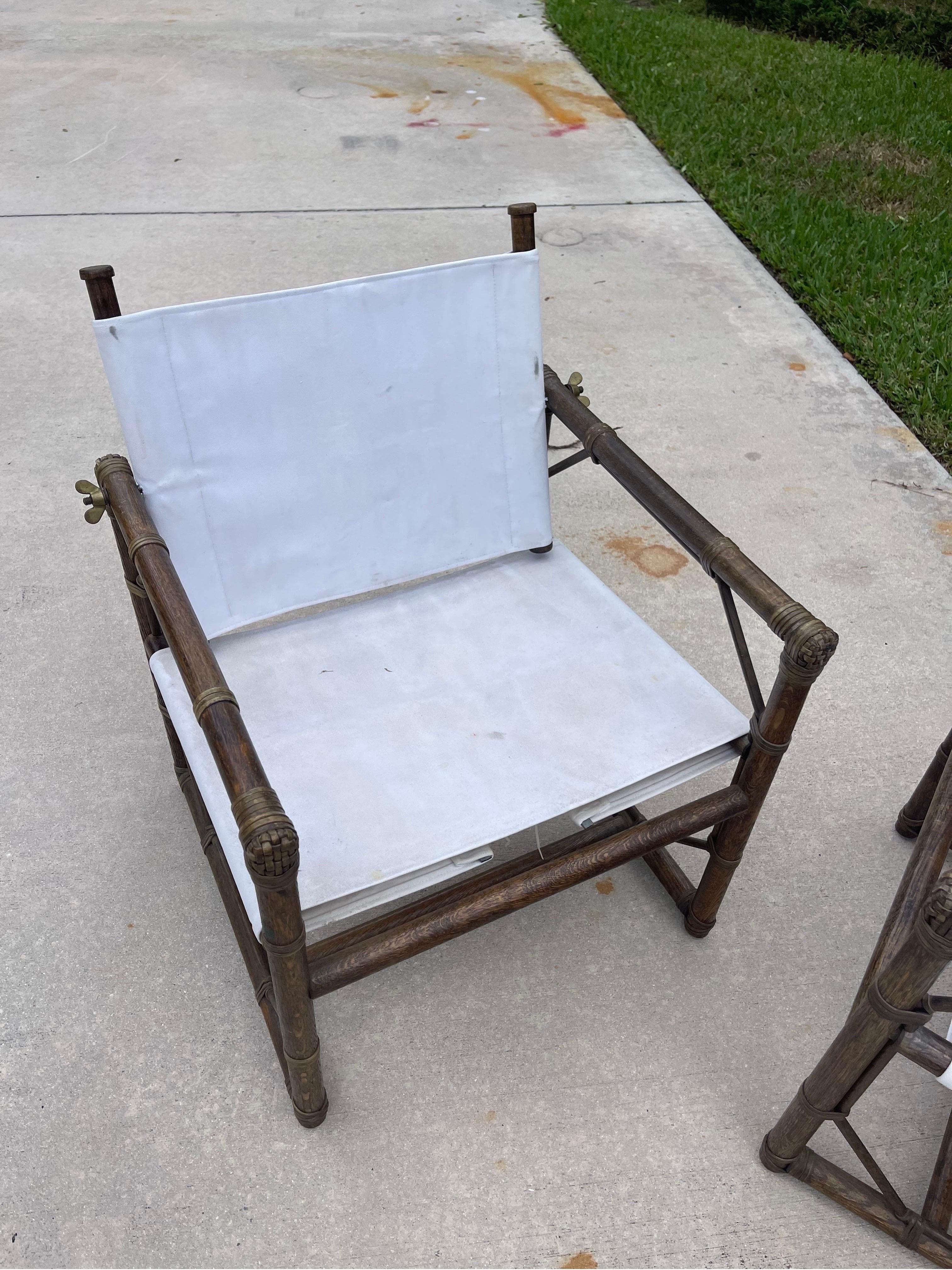 Designed by Eleanor Forbes for McGuire in the 1950s, this is an early, original pair of chairs—one of the first designs McGuire ever produced. Fine, hand-worked details such as the handwoven rawhide secured with a pin-nail. Whimsically large solid