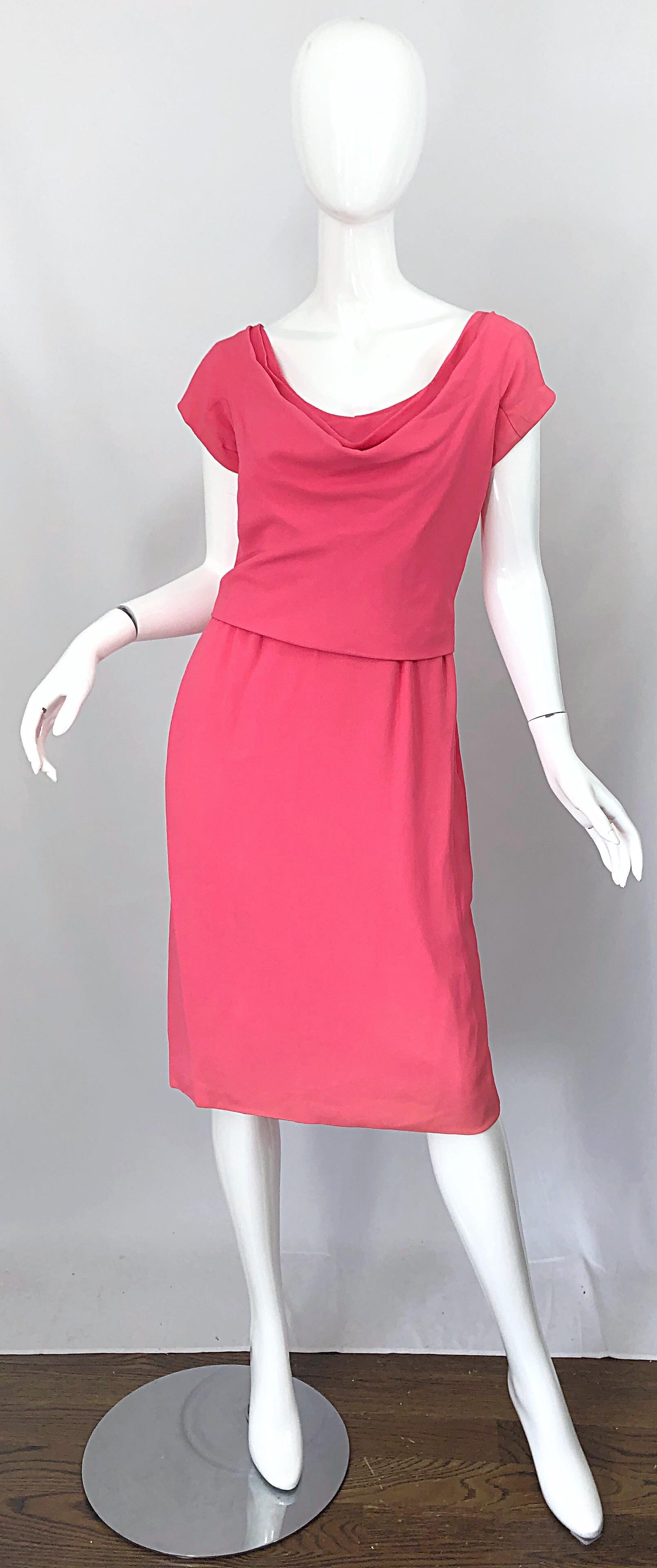 Chic and flattering late 1950s ELEANOR GREEN for MARY NORTON pink silk crepe short sleeve dress! Features the perfect shade pink with a tailored bodice with intricate draping at the bust. Hidden metal zipper up the back with hook-and-eye closure.