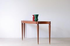 1950's Elegant console table with wavy top and tapered sides
