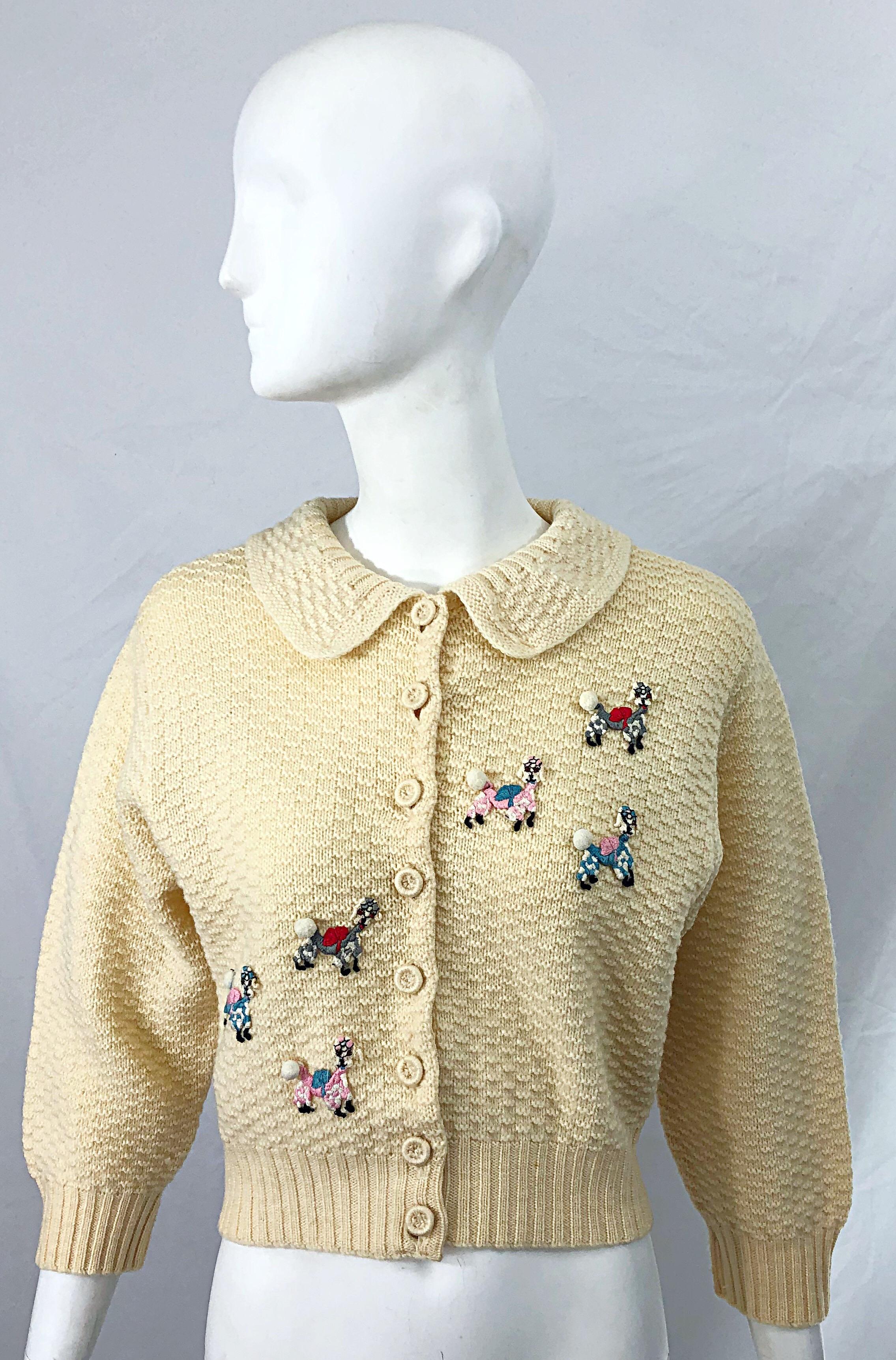 Rare and highly collectible 1950s ELSA SCHIAPARELLI novelty poodle themed ivory / off - white cardigan sweater ! Features six embroidered poodles on the front of the sweater. I have had quite a few Schiaparelli pieces, but this is one of the best !
