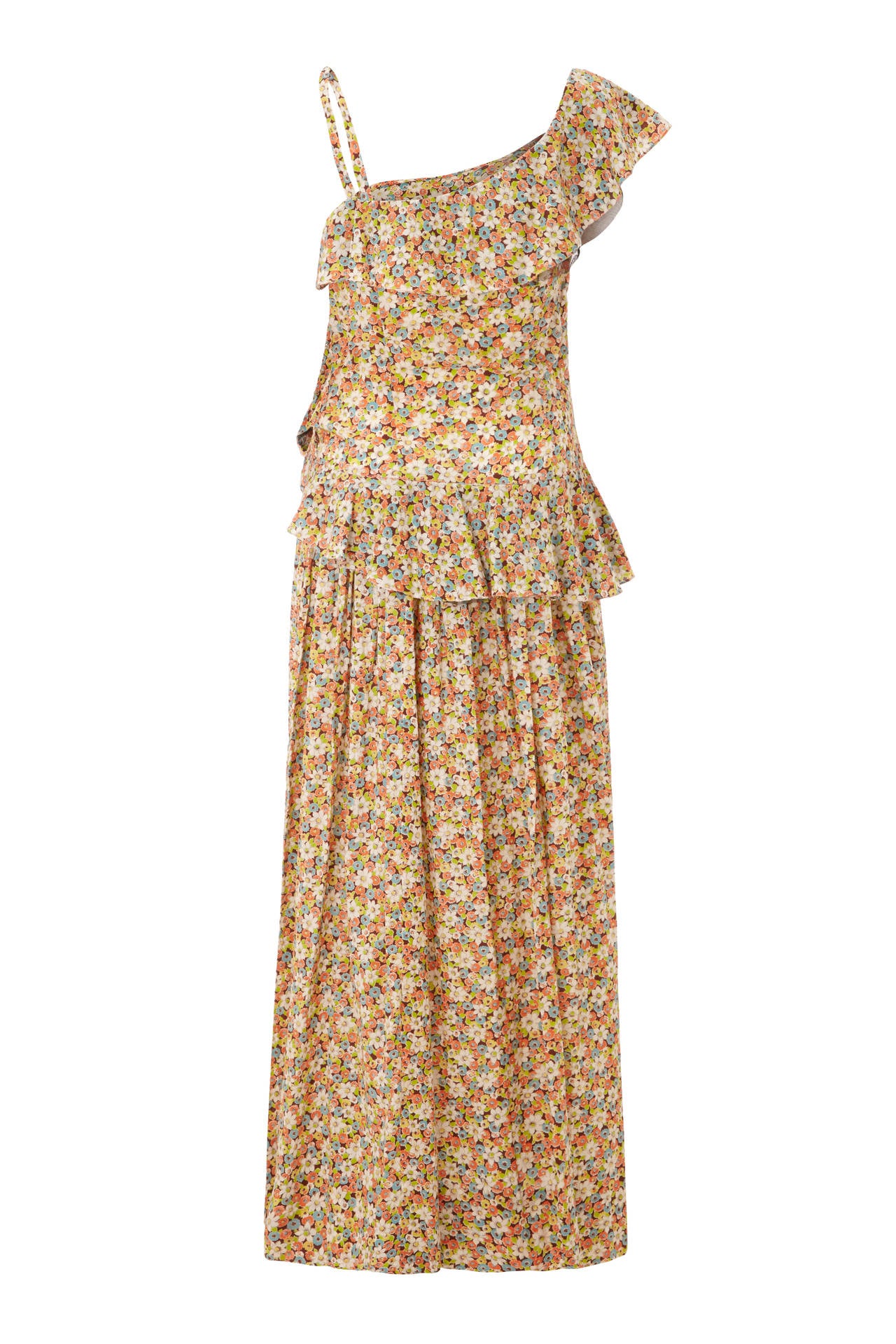 This lovely late 1940s/1950s cotton floral dress from Elysian is in beautiful vintage condition and has a summery floral print in cream, orange, blue, green and brown. The dress features a striking asymmetrical neckline with a single strap