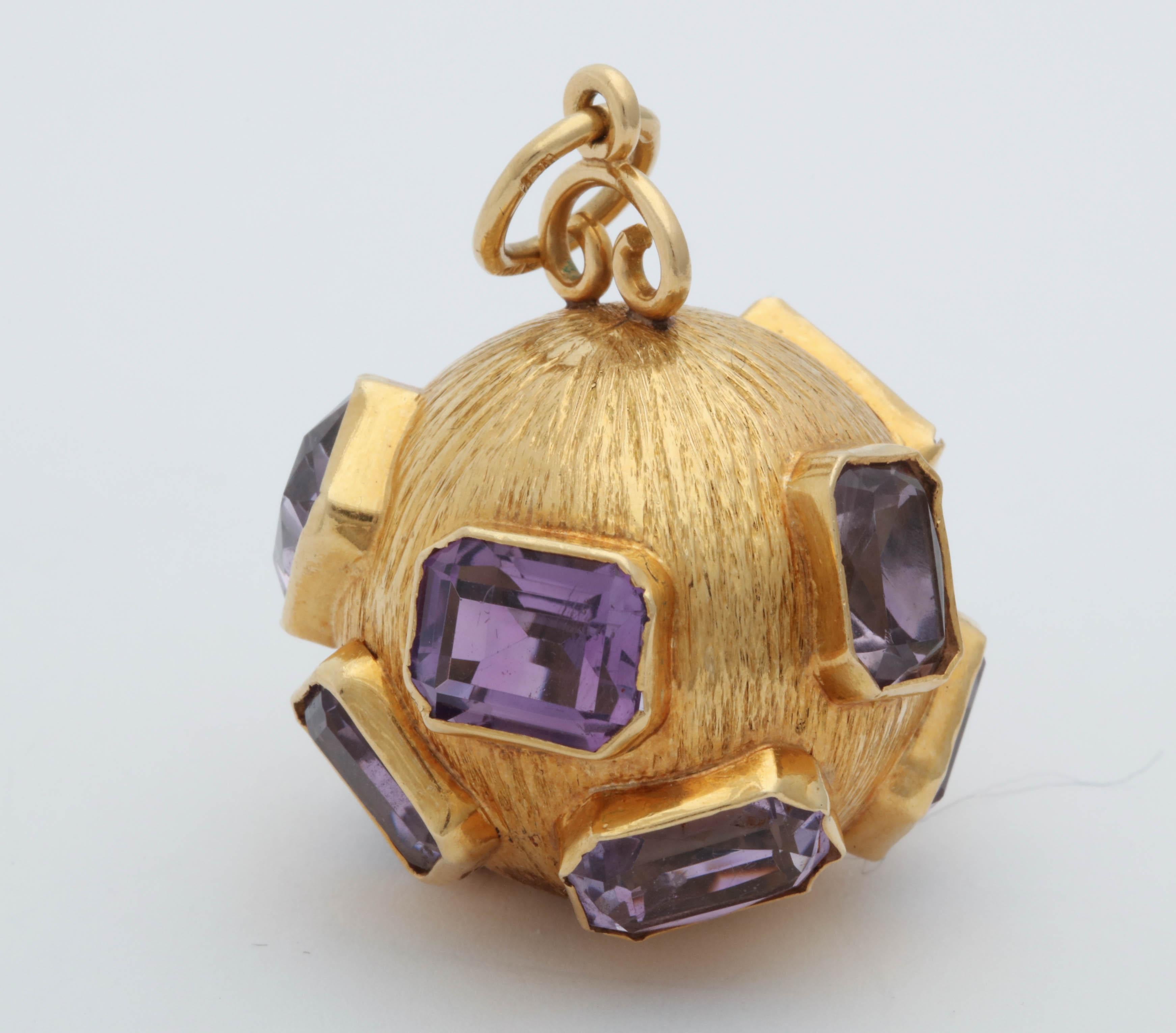 One 18kt Textured Gold Large Crater Charm Pendant Embellished With {10} Large Emerald Cut Amethyst Stones Weighing Approximately [50] Carats Total Weight. Beautiful Large 18kt Gold Bail To Hook Thru Any Chain Or Bracelet Easily.Designed In The