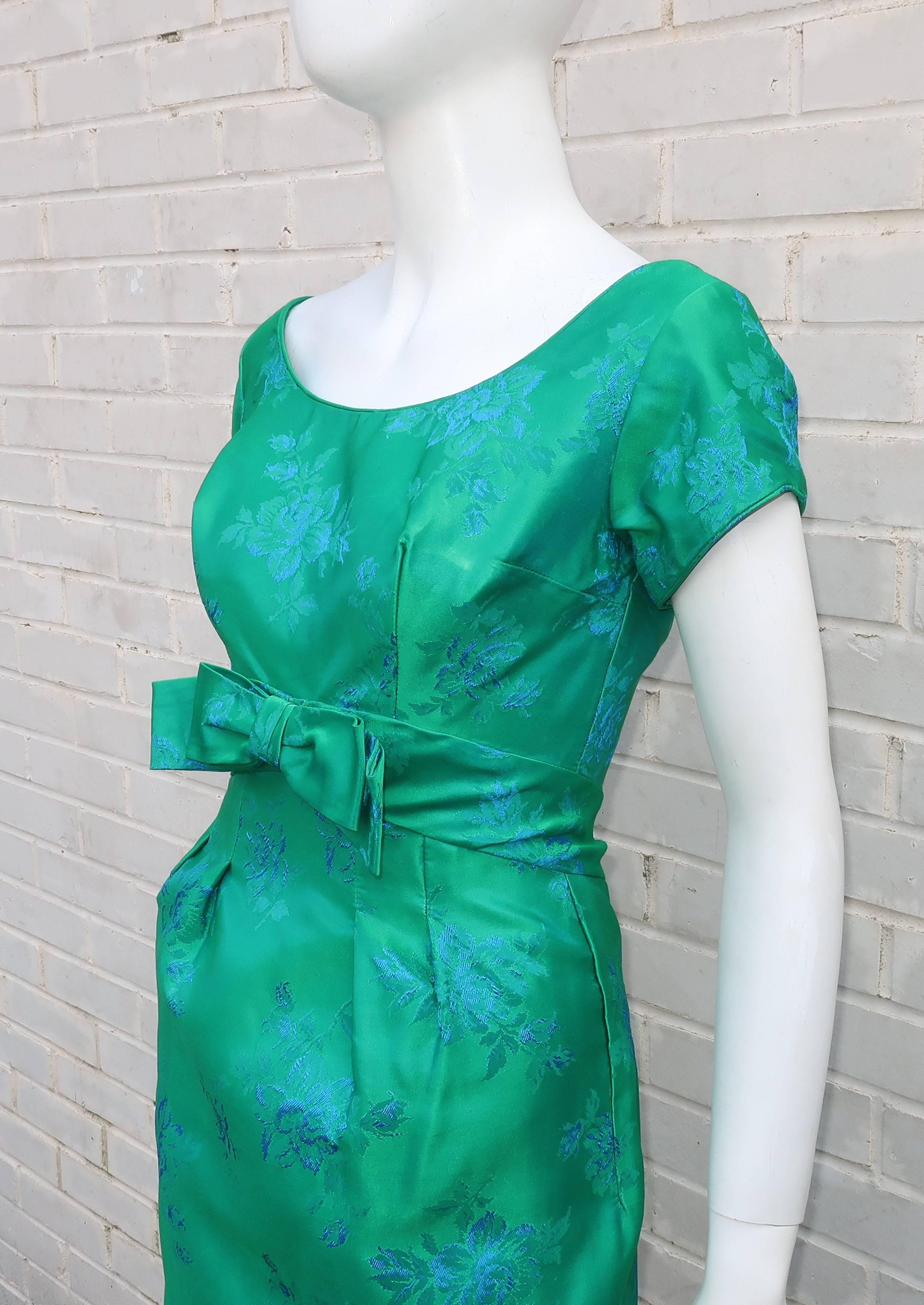 Emma Domb is the bomb!  This 1950’s bombshell dress is worthy of an houglass figure and a stylish cocktail party.  The vibrant blue and green floral brocade fabric is a beautiful backdrop for the ballerina style neckline and modified empire waist