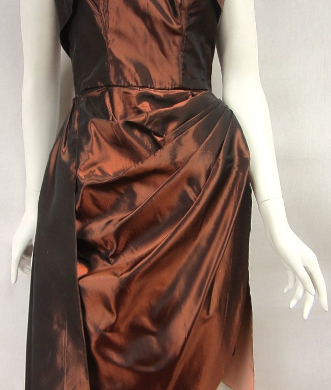 Amazing copper color on this sexy Emma Domb Cocktail Dress. Circa 1950s. Has a strapless boned bodice with ruched front along with a sarong draped at the front which extends a bit longer than the skirt. This dress is so well made details and more