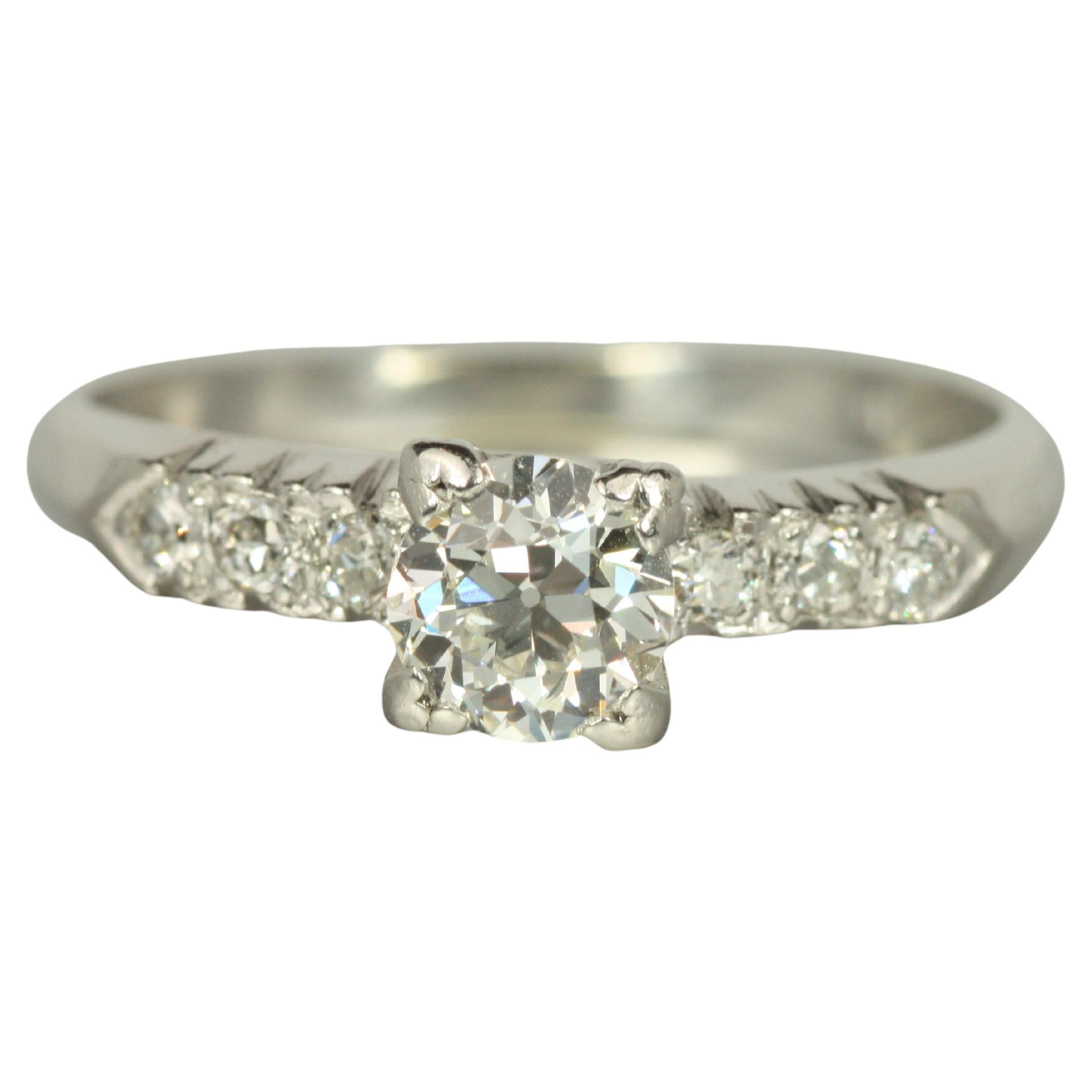 Bague de fiançailles des années 1950 - 0,62ct diamants vieux européens et ronds en platine