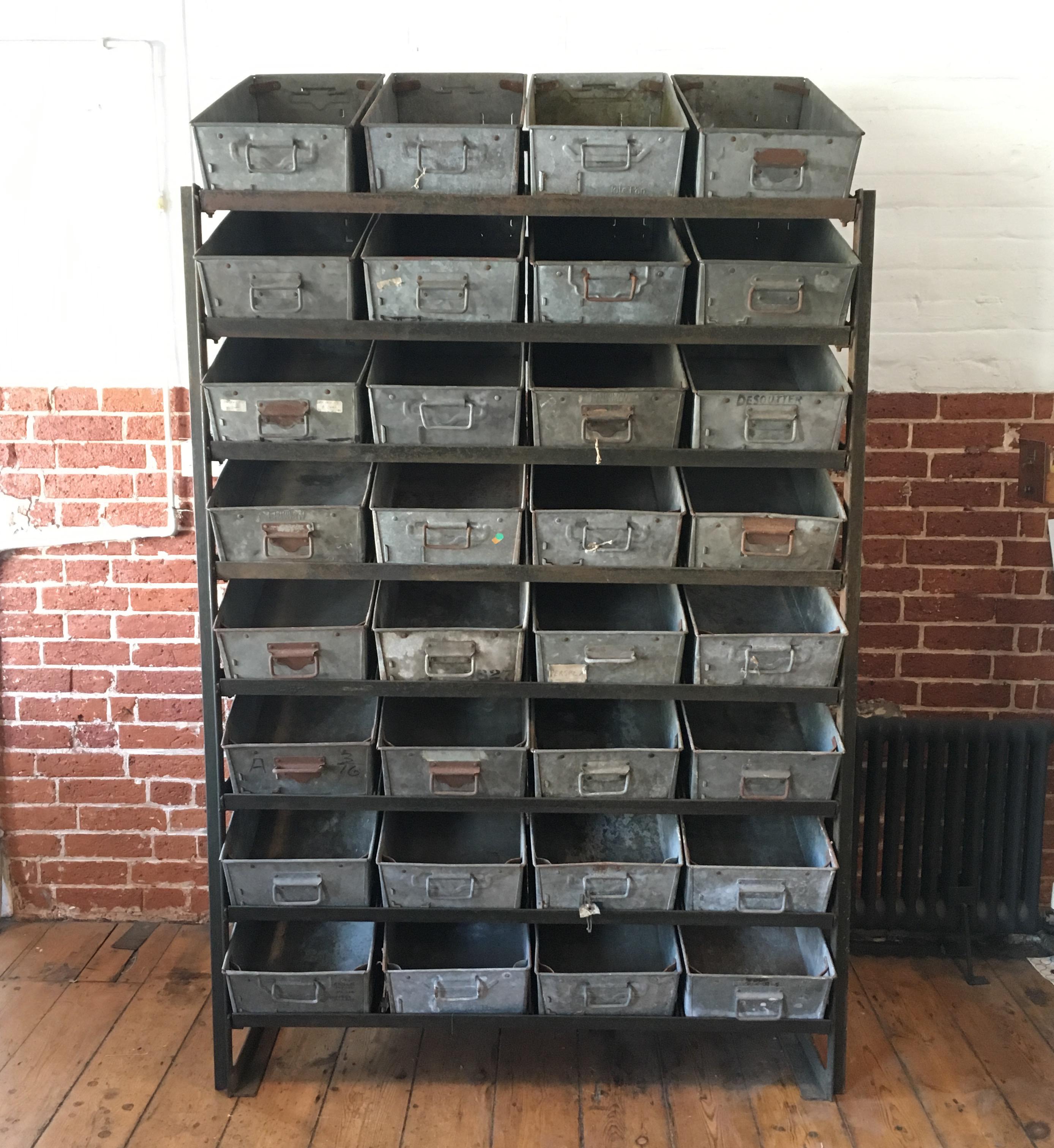Vintage industrial engineers storage racking with 32 drawers, circa 1940s-1950s. Heavy iron frame work with galvanised metal storage bins/drawers, 32 drawers totally, 2 are missing from some of the photograph but the drawers are complete, we have