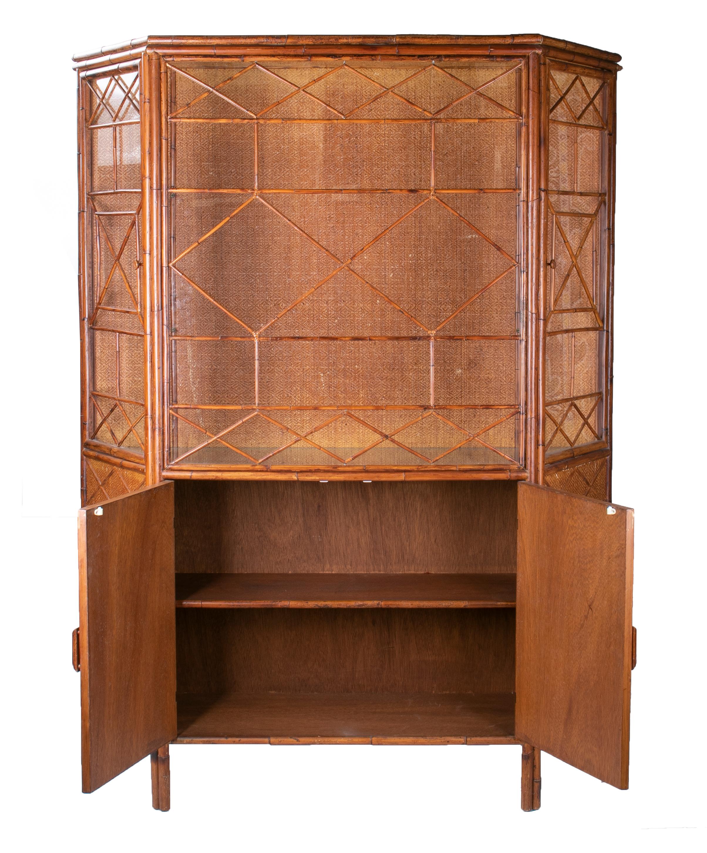 1950s English bamboo and rattan glass cabinet.