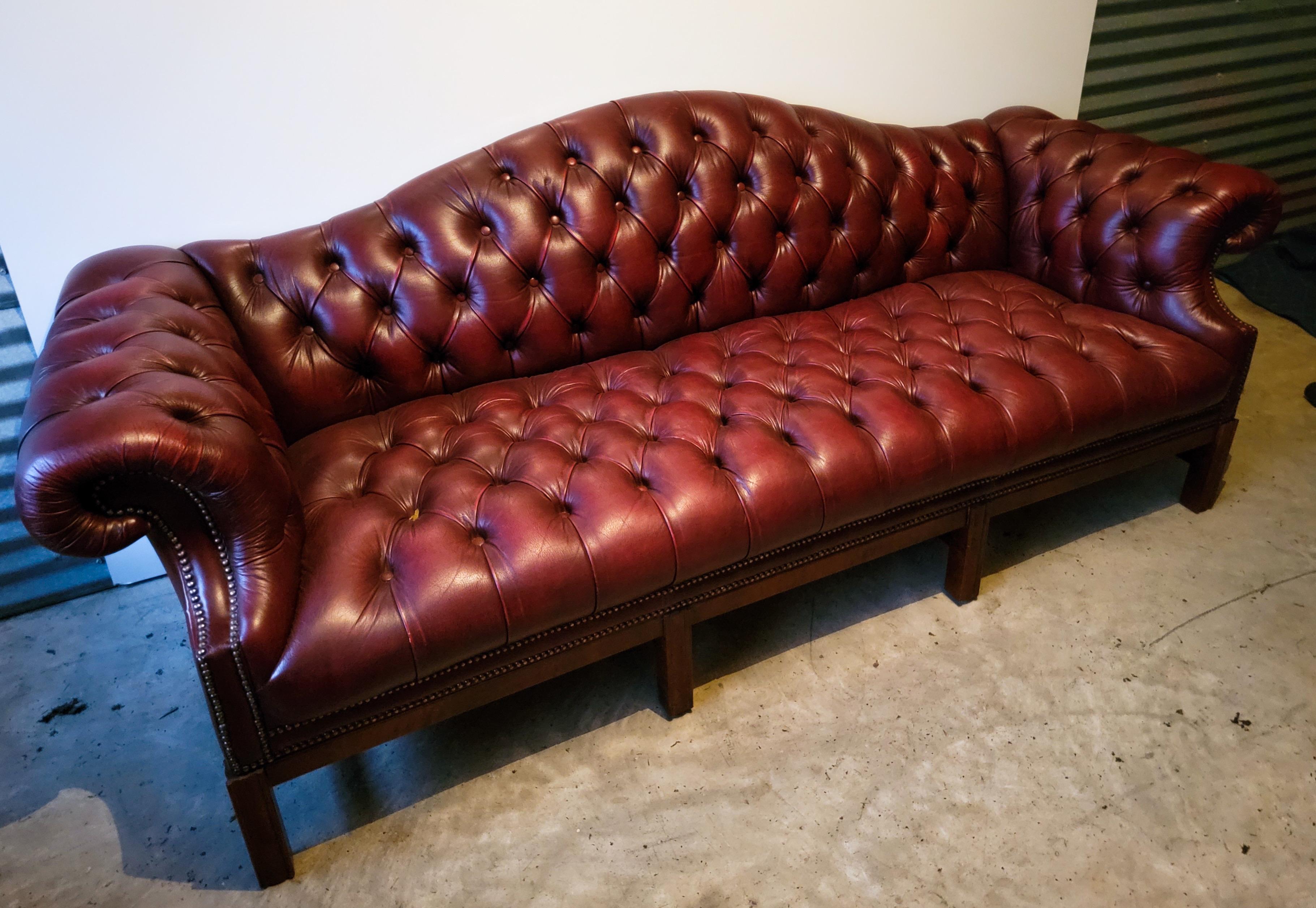 tufted camelback sofa