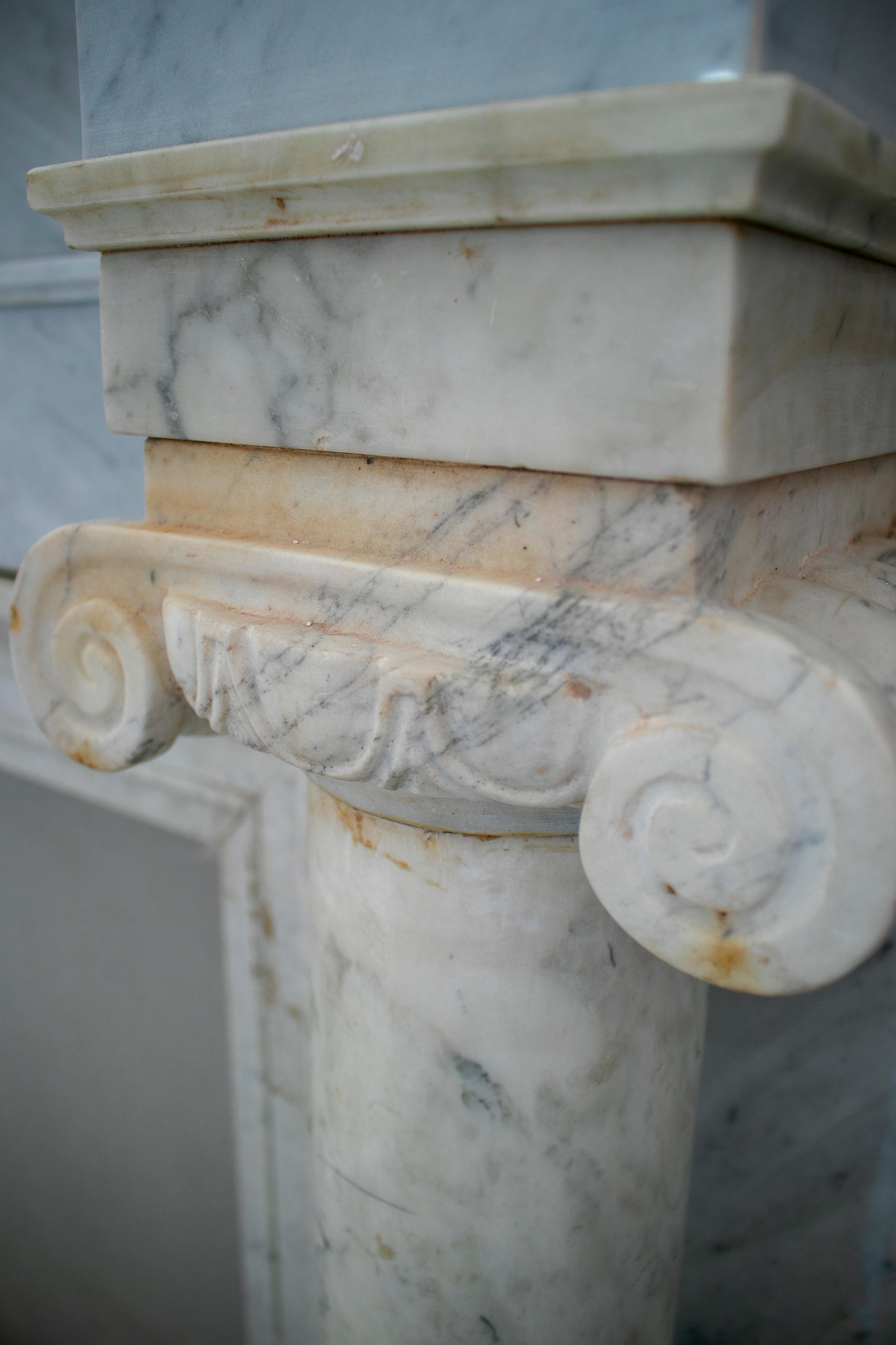 20th Century 1950s English Hand Carved Marble Fireplace with Ionic Columns For Sale