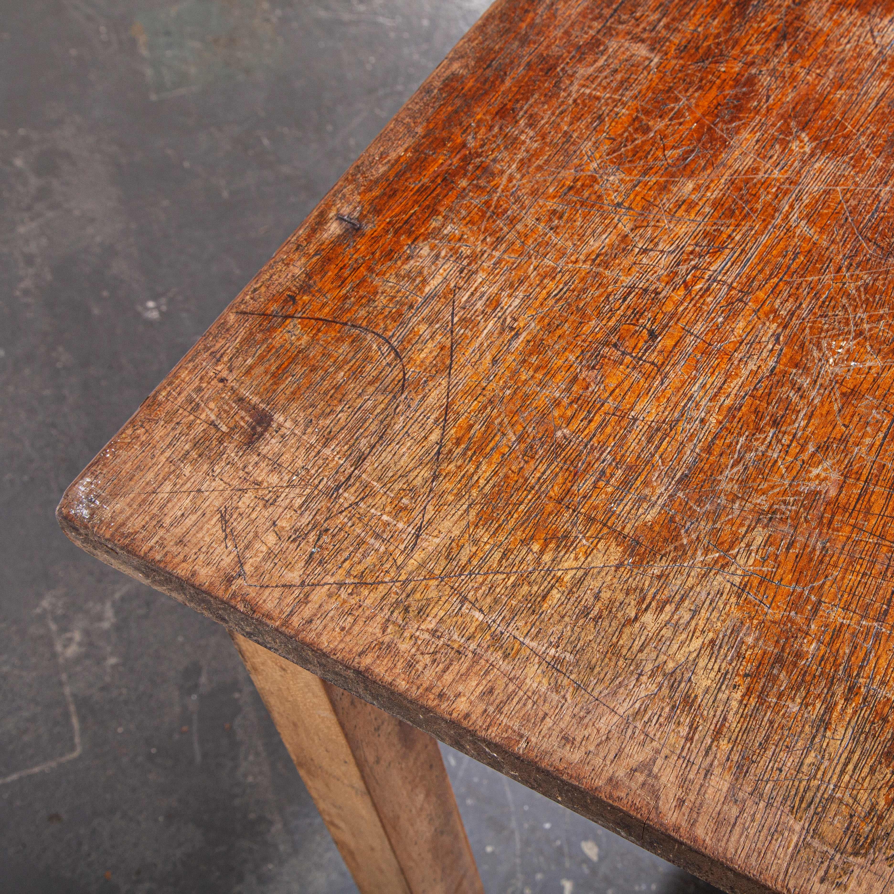 1950s English original school laboratory dining table with solid iroko top. A Classic lab table with heavy beech sub frame and solid iroko top full of years of students use and markings.

Workshop report
Our workshop team inspect every product