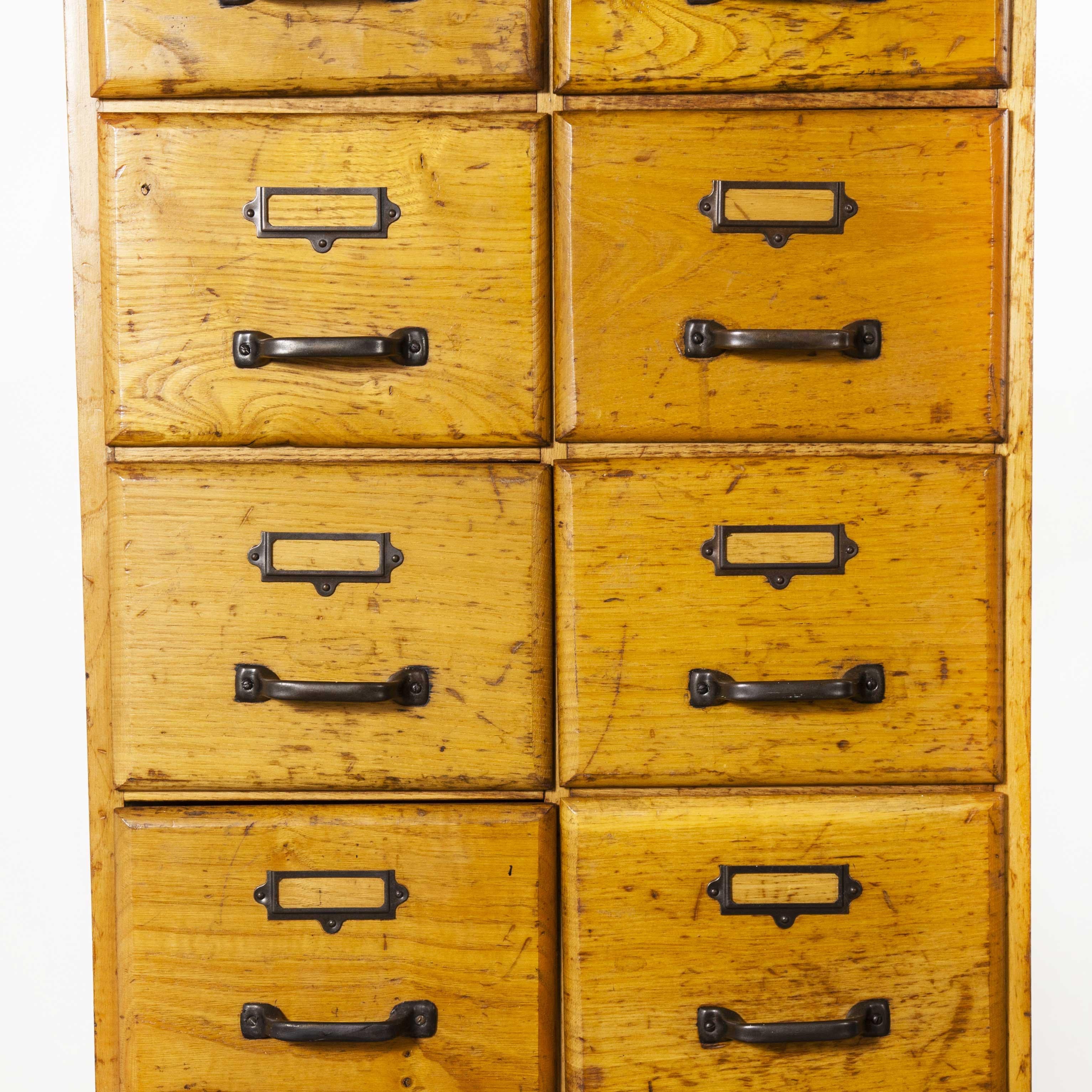 1950s English tall slim oak multi drawer chest of drawers – fourteen drawers. We recently salvaged a whole collection of original haberdashery shop cabinets from the original haberdashers in the north of England. This tall drawer unit was in the