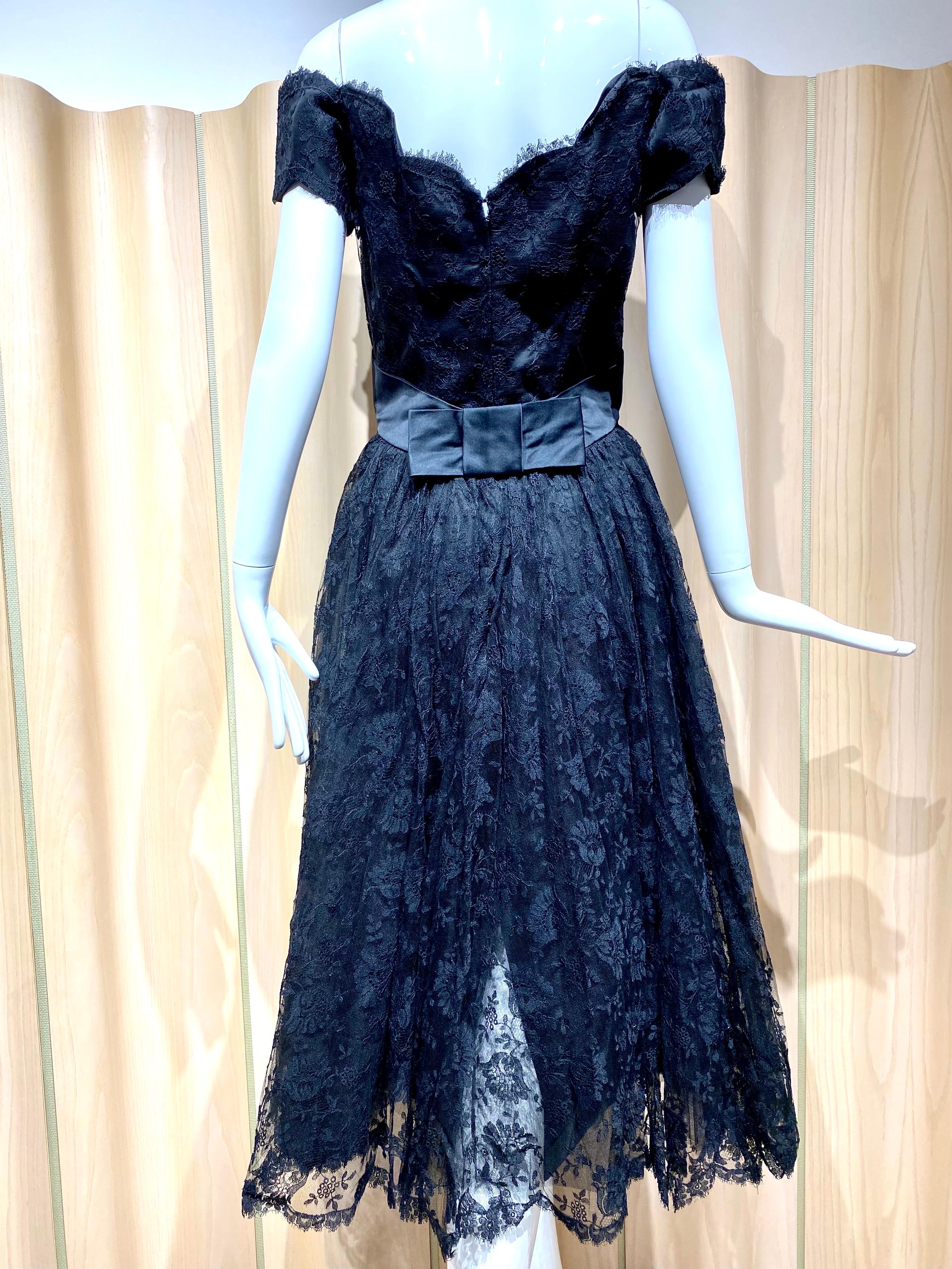 Timeless 1950s Estevez Black lace off shoulder cocktail dress.
Bust: 34”/ Waist 28”
