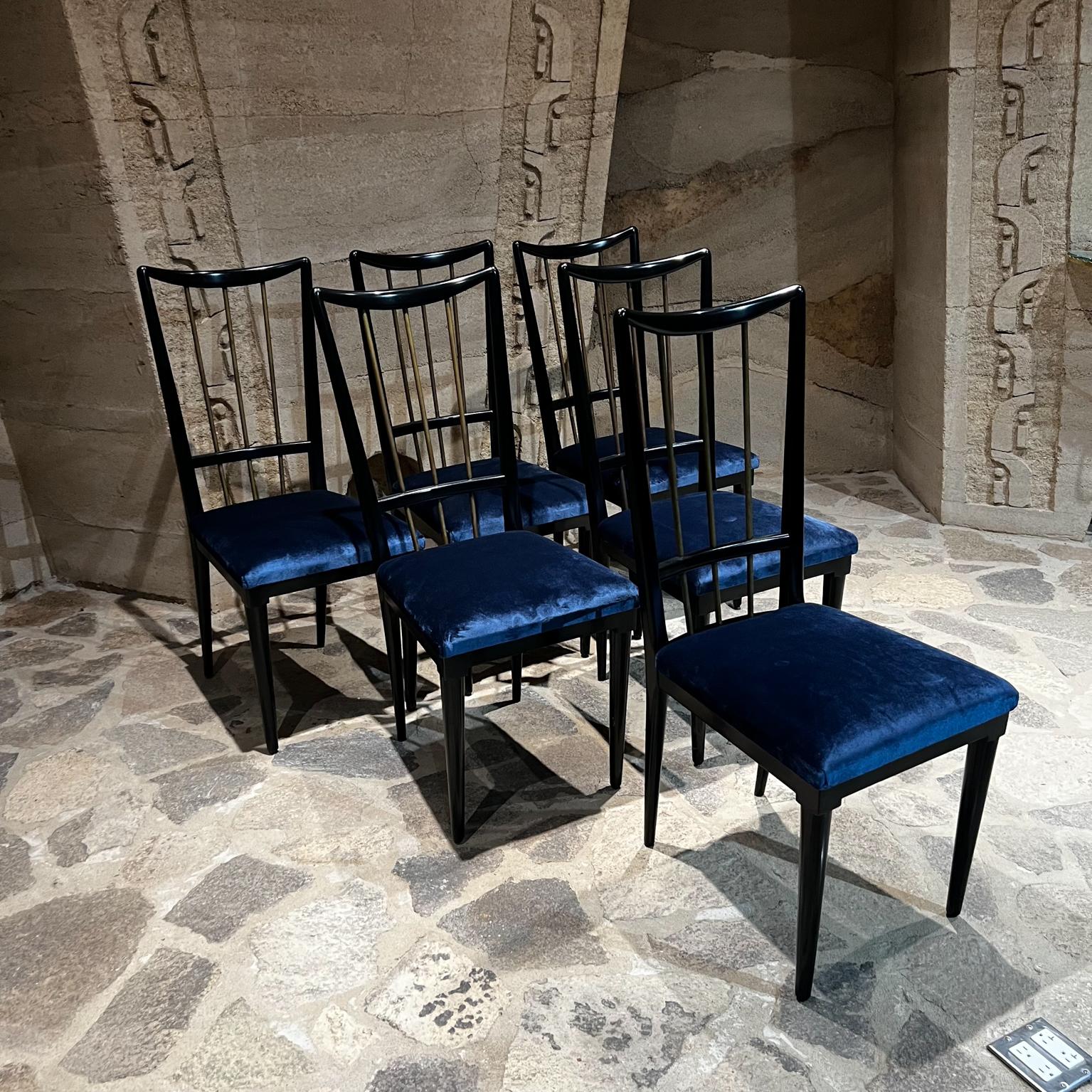 Sophisticated dining set Ebonized Mahogany wood dining table 
Six blue velvet chairs
Mexico circa 1950s
Attributed to Eugenio Escudero. Unmarked.
Set includes six dining chairs and an oval shaped dining table.
Mahogany Wood ebonized with black