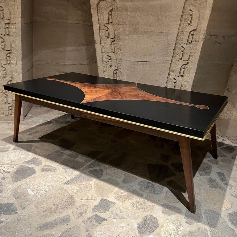 Sculptural Mosaic Dining Table
1950s Style of Eugenio Escudero Sculptural Black Mahogany Mosaic Wood Dining Table Mexico
Stunningly elegant design
29 tall x 86.75 x 46d, knee clearance 22.75
Preowned original vintage condition. Restored finish.
See