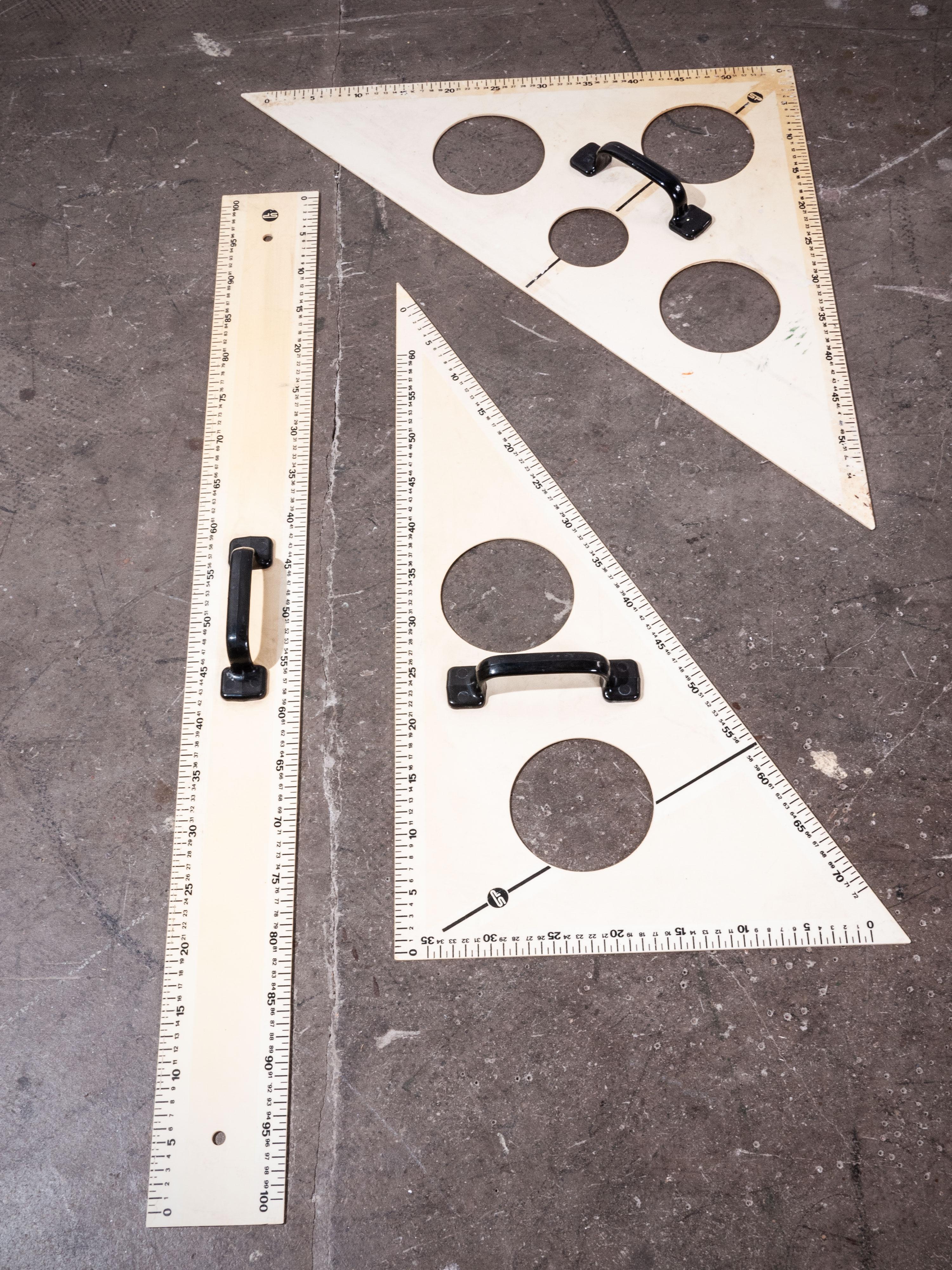 1950s extra large blackboard measures set, three pieces
1950s extra large blackboard measures set. Made from a dense opaque acrylic with chunky black handles. Ruler is 103 cm in total length.

Workshop report
Our workshop team inspect every
