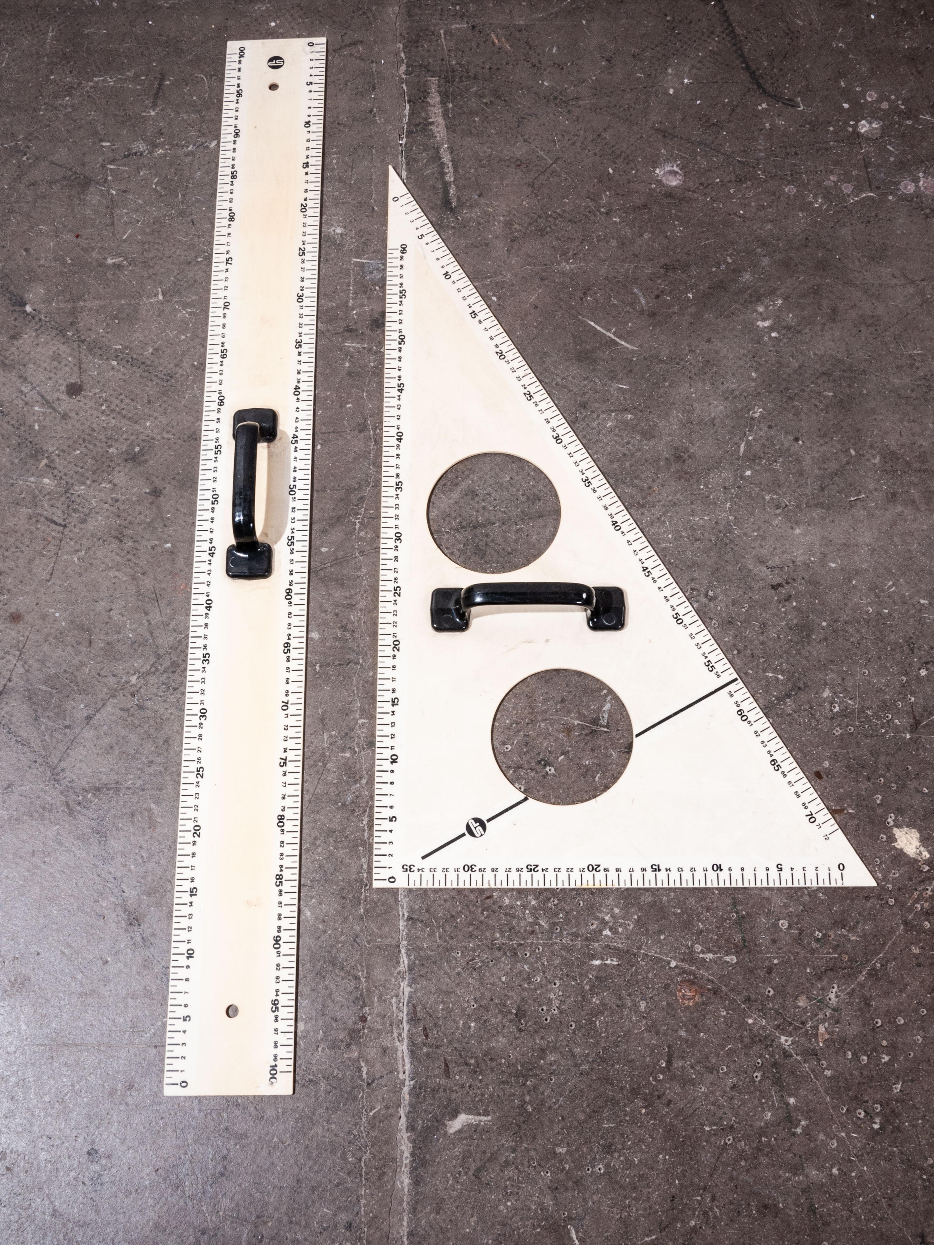 1950s extra large blackboard measures set, two pieces
1950s extra large blackboard measures set. Made from a dense opaque acrylic with chunky black handles. Ruler is 103 cm in total length.

Workshop report
Our workshop team inspect every