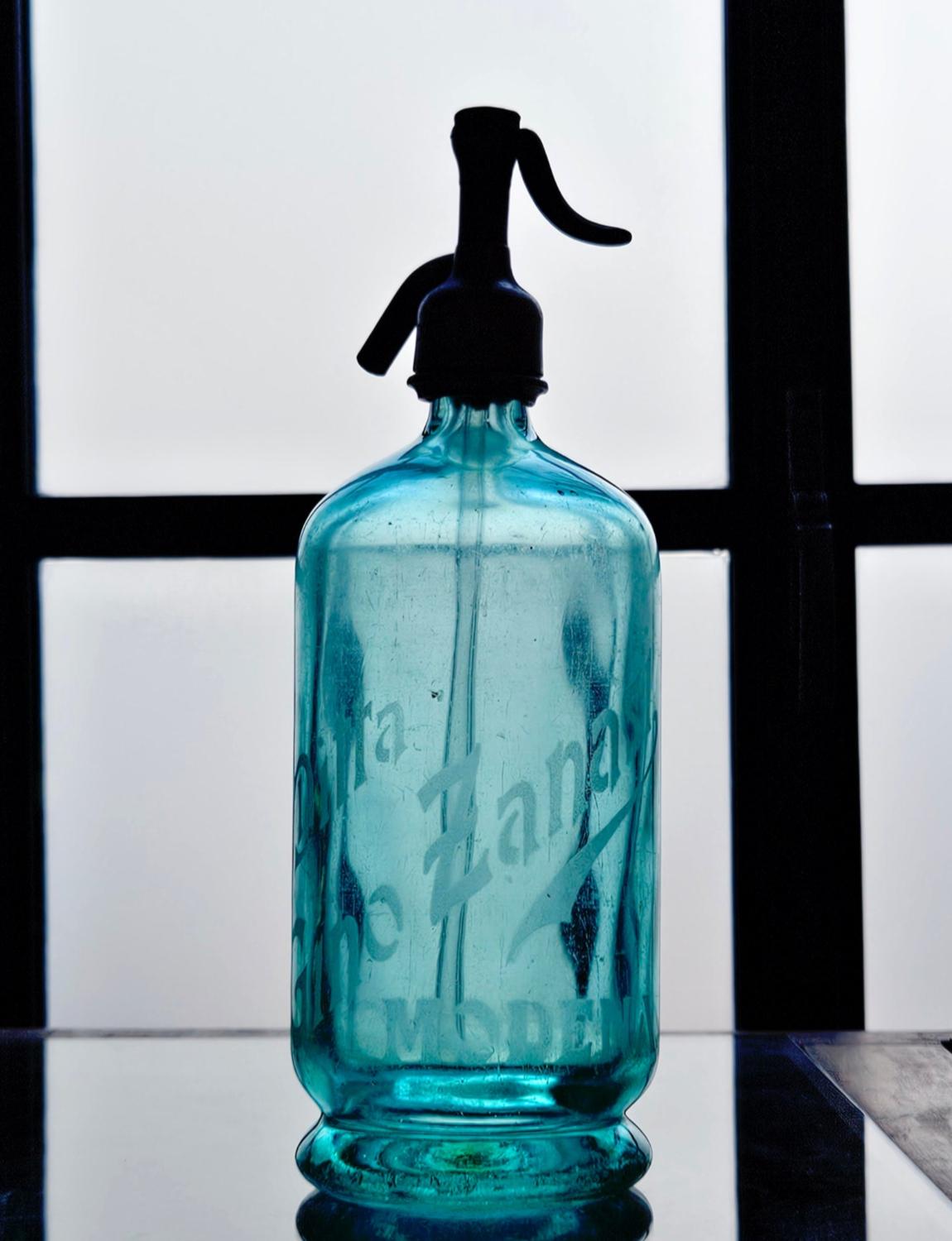 1950s Green Soda Bottle with the name of the (bar) owner - Rocco Chiari on the front and Aqua di Seltz on the back.  A spectacular decorative piece for a home bar and display.