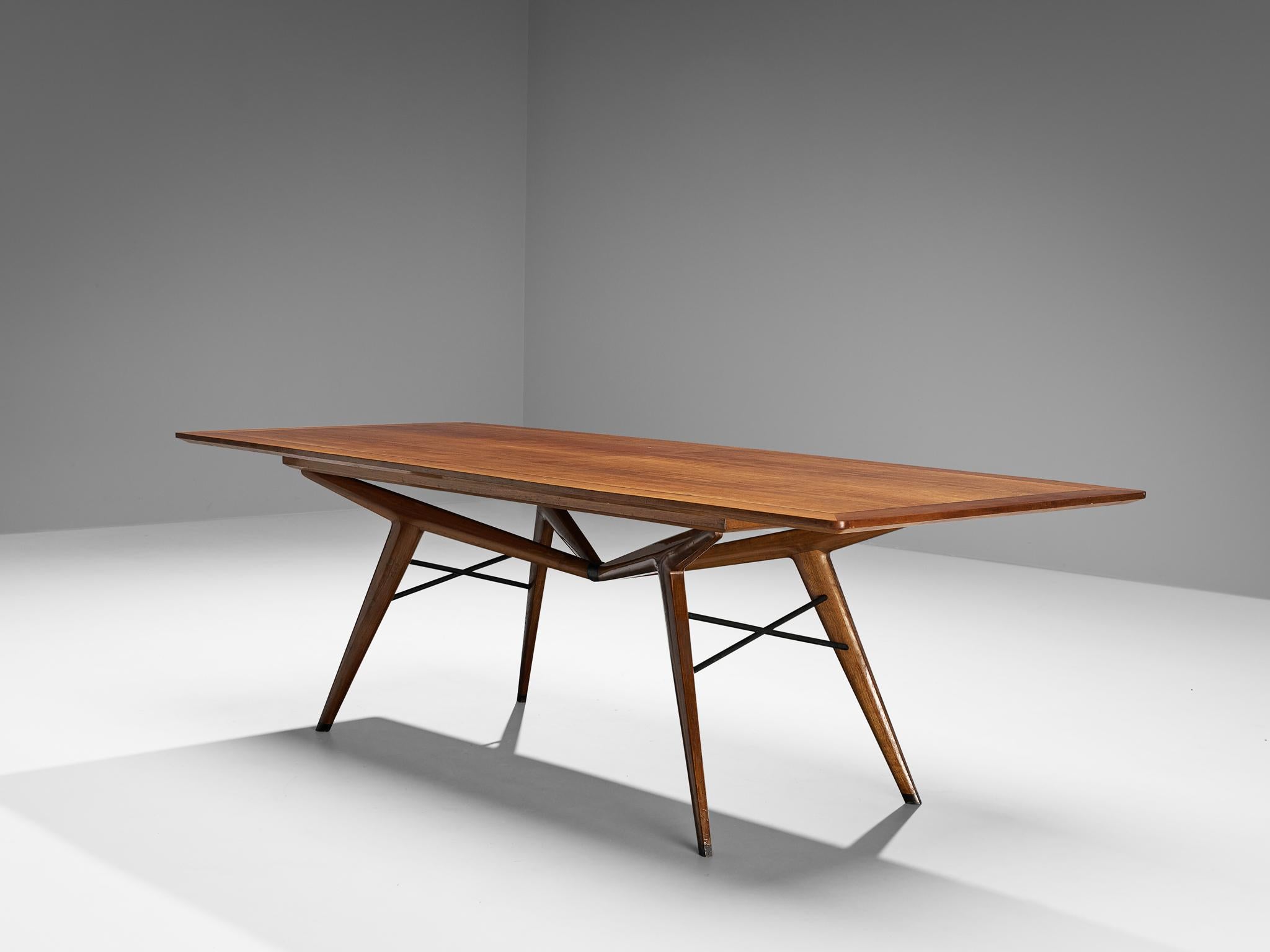 Dining table, walnut, bronze, brass, Italy, 1950s

Hailing from a skilled artisan of Italy, this dining table epitomizes excellence in its form, material use, composition, and craftsmanship. With an unidentified but undoubtedly highly talented maker
