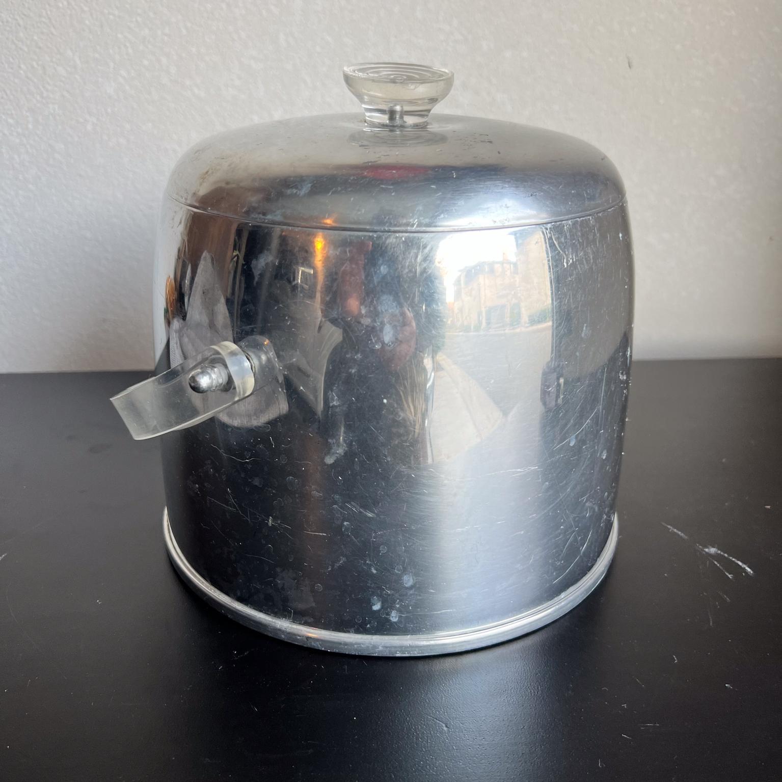 AMBIANIC presents
1950s Fabulous Atomic Ice Bucket by Kromex in Lucite and Aluminum
after Russel Wright design
8.25 diameter x 7.75 h 9 h handle
Preowned vintage condition
Refer to all images