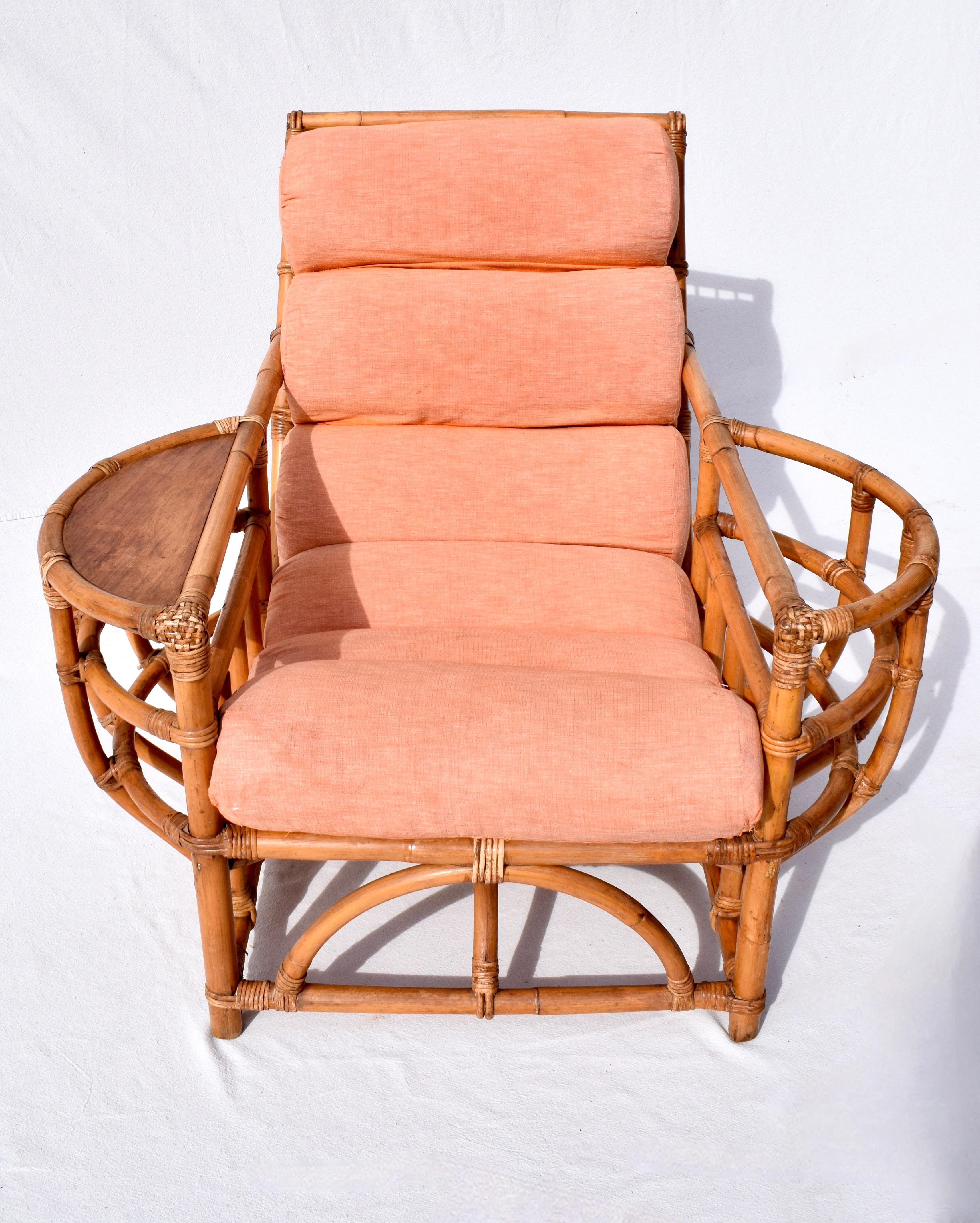 American 1950s Ficks Reed bent bamboo lounge chair with unusually well maintained and preserved original channeled canvas upholstered cushion, magazine pocket & beverage surface.  A rare style in form and condition. Seat: 16