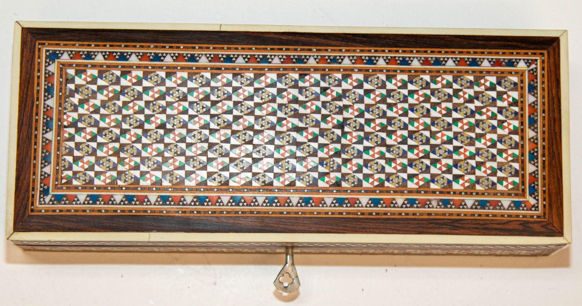 1940s Fine Handcrafted Syrian Mother-of-Pearl Inlay Box.
Exquisite handcrafted Middle Eastern mosaic marquetry inlaid walnut wood box.
Large box intricately decorated with Moorish motif designs which have been painstakingly inlaid with mosaic