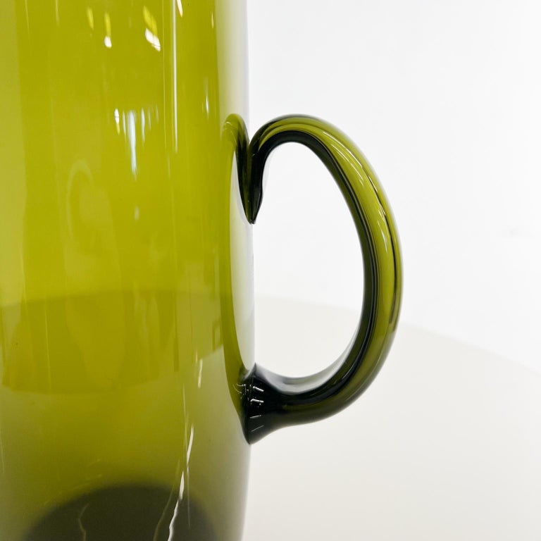 1950s Finland Scandinavian modern green glass pitcher by Erkki Vesanto Iittala
Measures: 11.25 tall x 5.75 d x 3.75 diameter at widest point
Preowned vintage original condition.
Refer to our images listed.
 