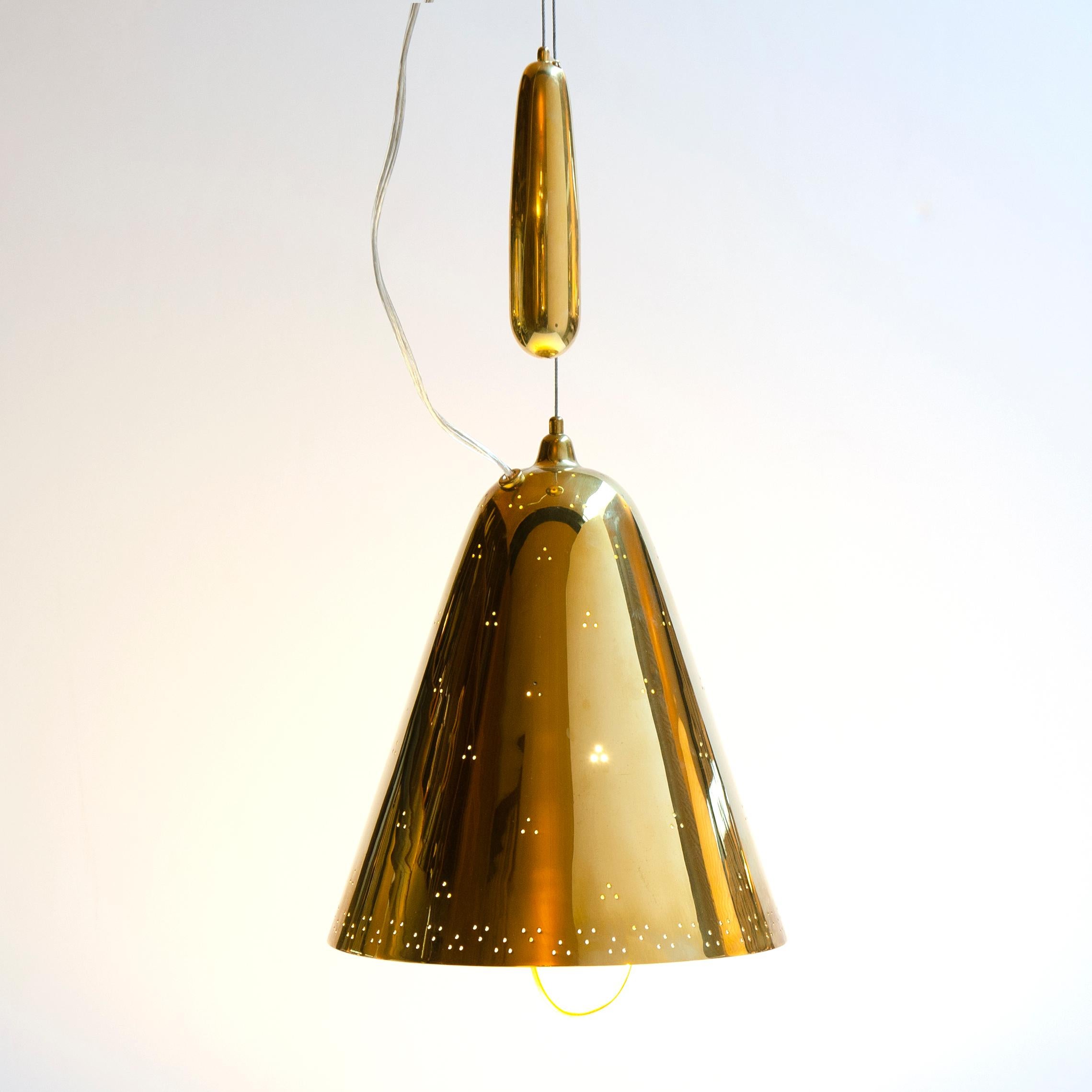 An uncommon and masterful adjustable counterweighted ceiling fixture having a brass bell-shaped dome with pin-hole perforations.
