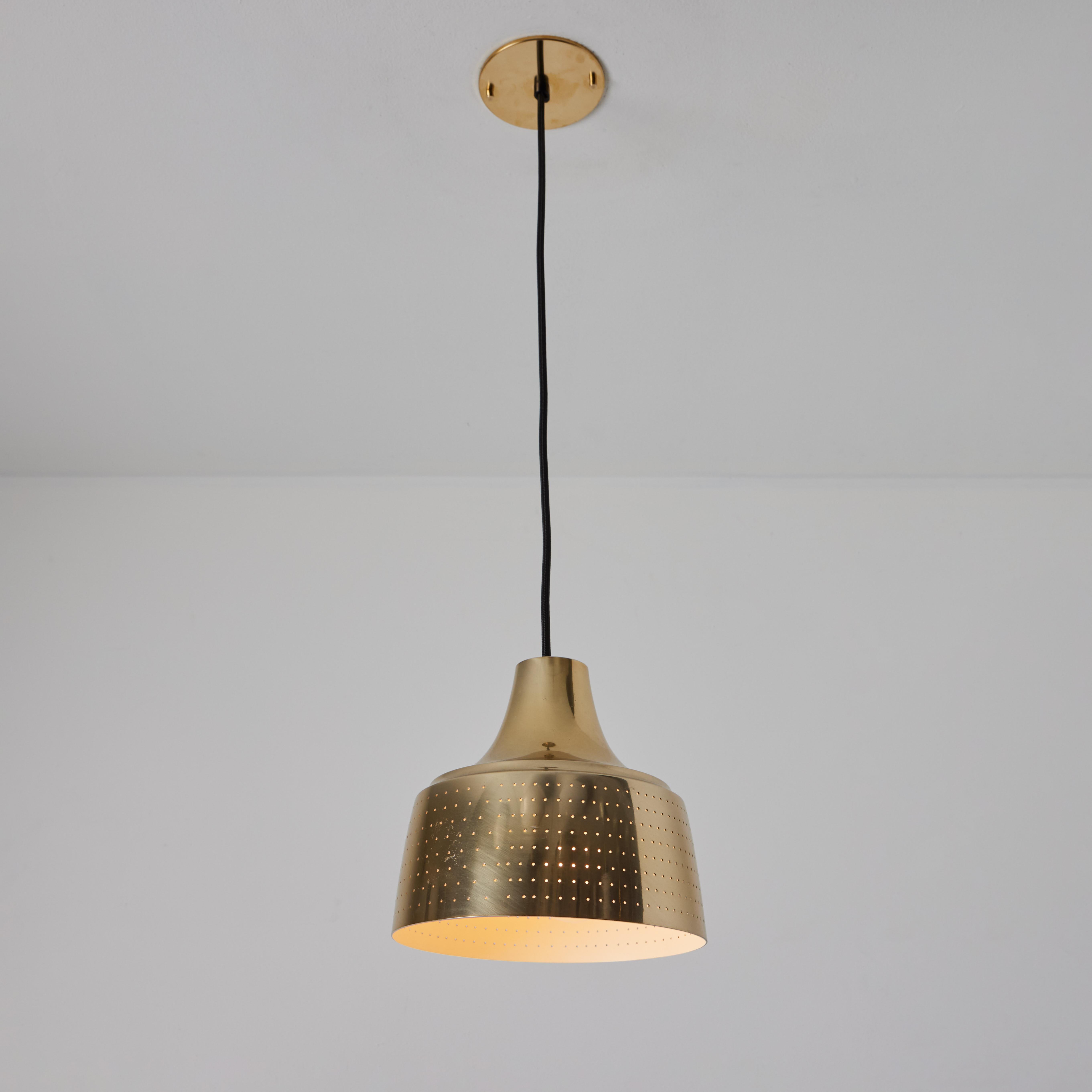 1950s Finnish Perforated Brass Pendant In The Manner of Paavo Tynell

Executed in perforated brass with an attractive patina, this sculptural pendant lamp is highly characteristic of Tynell's iconic work for Taito Oy in the late 1940s or early