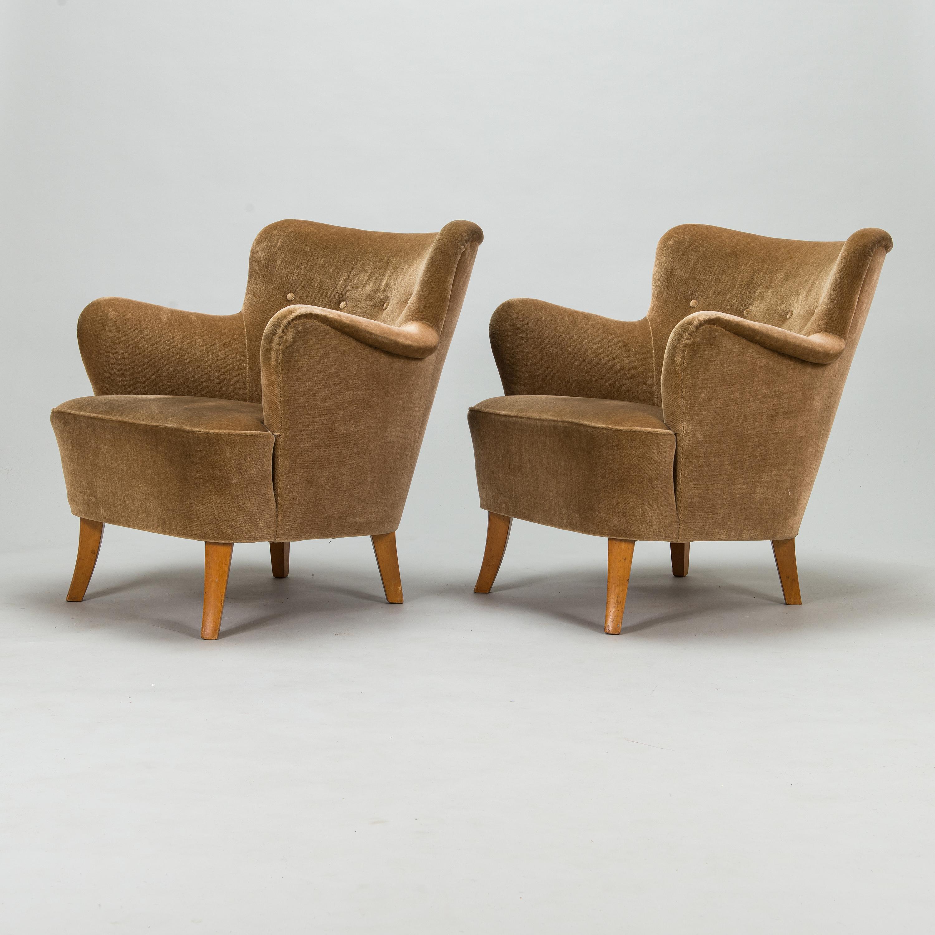 Mid Century Finnish armchairs upholstered in a soft moss green color. This timeless shape is both elegant and classic. Chairs are from the 1940's and the upholstery was done later. 

(If final destination is in California or the West Coast, the