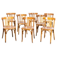 Chaises de salle à manger en bois bentley français à dossier sellier Fischel des années 1950 - Ensemble de huit chaises