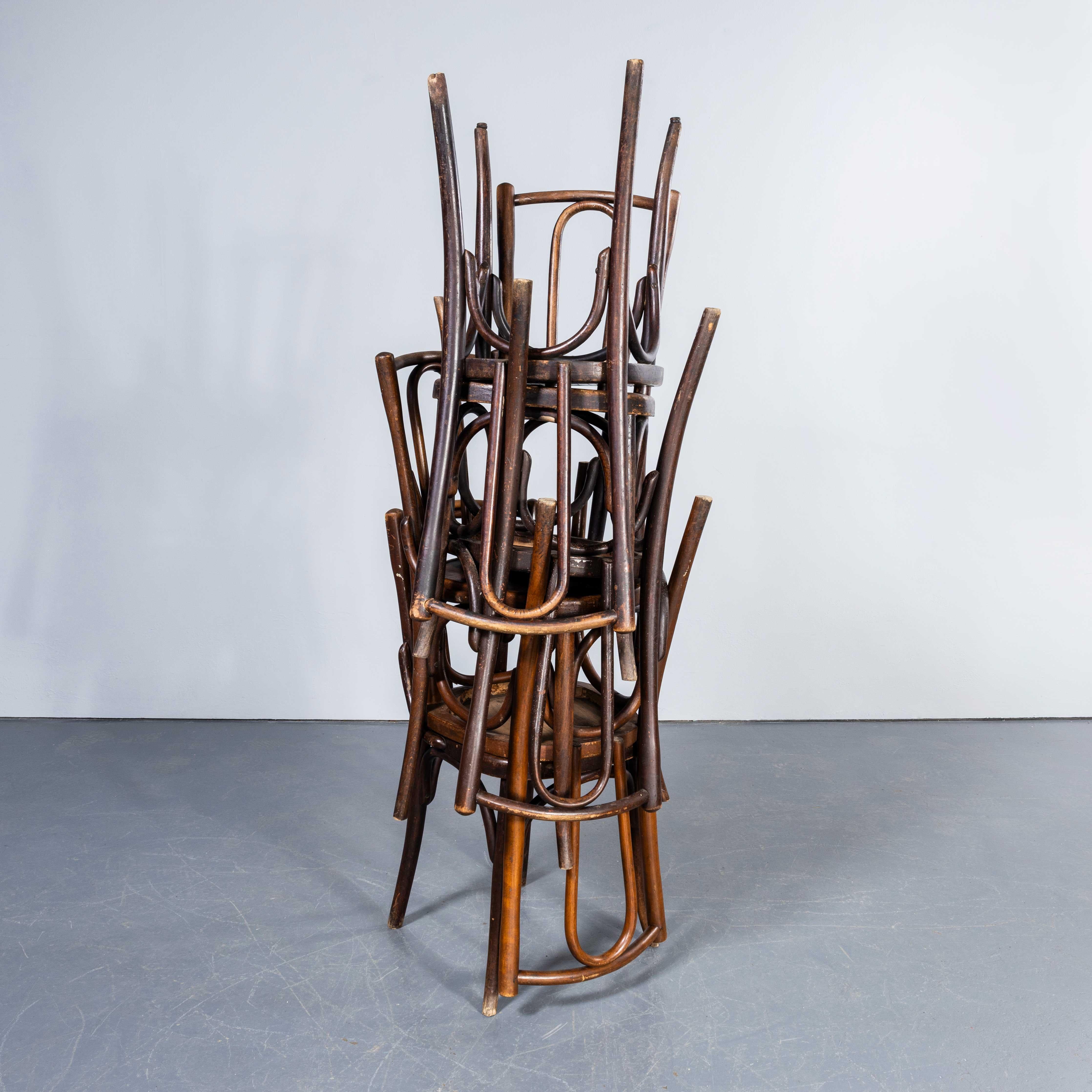 1950's Fischel Hooped Back Dark Oak Dining Chairs - Set Of Six. 
The process of steam bending beech to create elegant chairs was discovered and developed by Thonet, but when its patents expired in 1869 many companies including Fischel launched