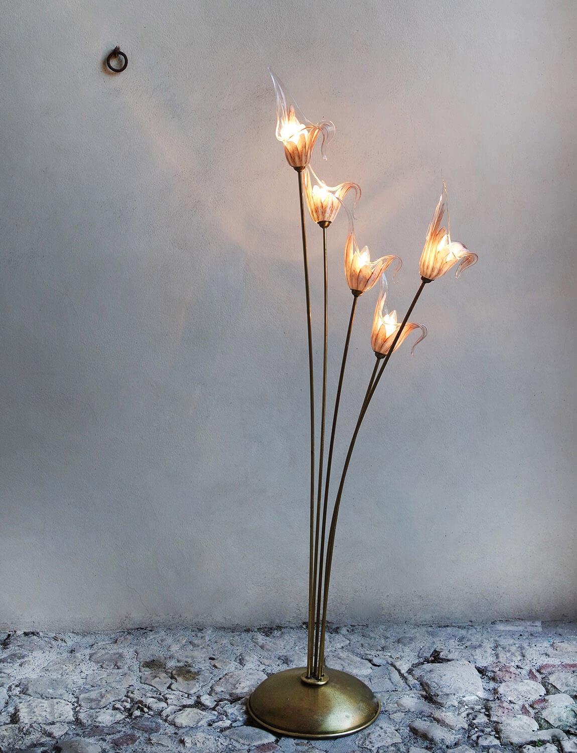 Found in a palazzo in Naples, this extraordinary Murano glass floor lamp has five hand-blown tulip-like glass flowers surrounding each bulb. The hand-blown coloured glass of each flower is in very good condition. The brass 'branches' move around