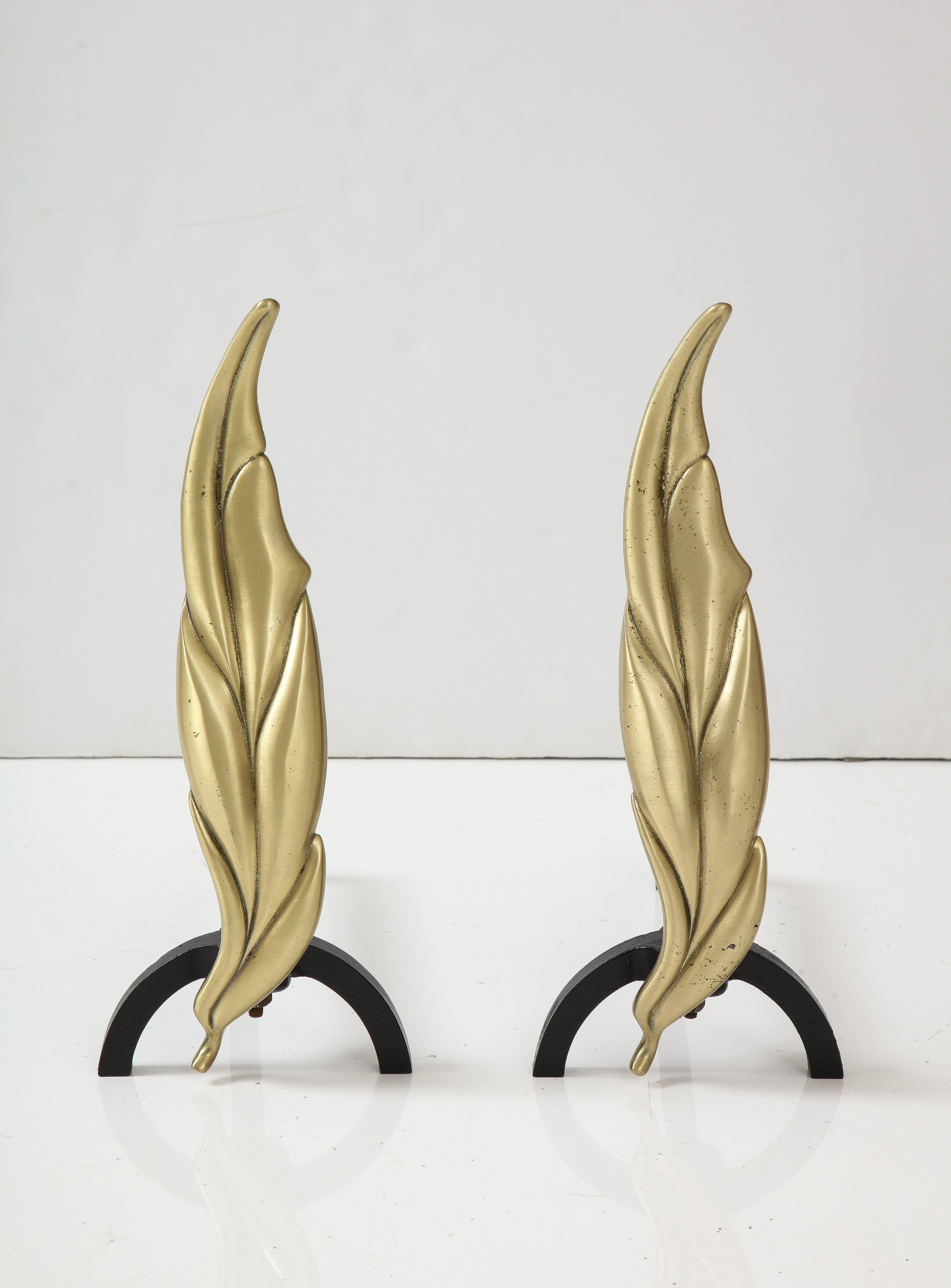 1950's Mid - Century Modern Flamed leaf Andirons with matching fireplace tools.
The bras leaf forms sit on Newly re-finished iron stands and are in Great vintage condition.
The matching leaf form fire place tools are in the same brass finish as the