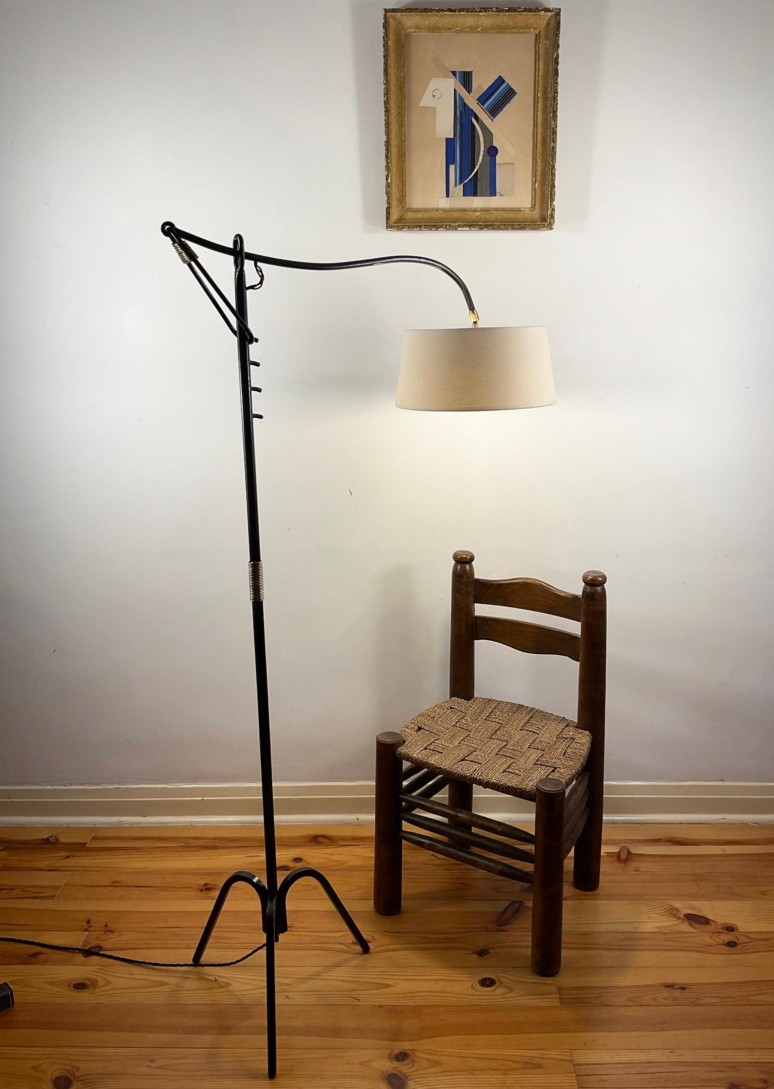 1940s floor lamp attributed to Jacques Adnet with adjustable arms named 